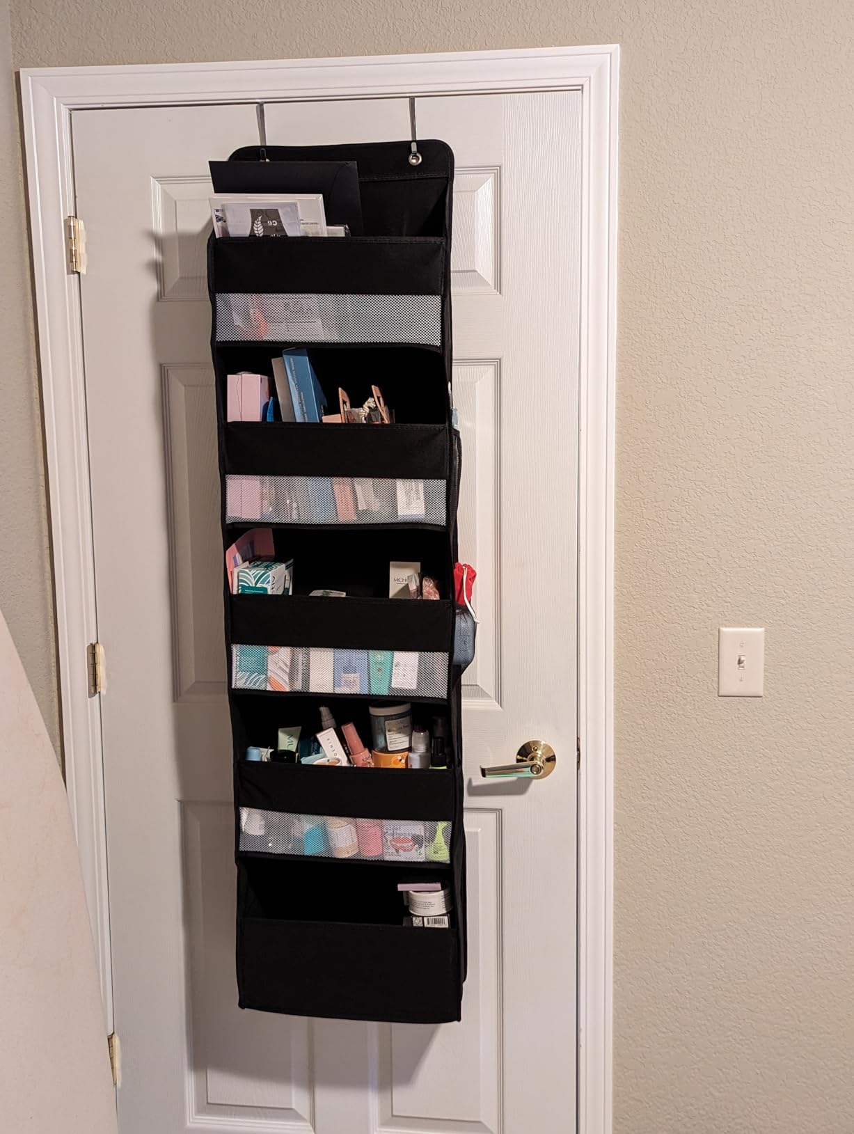 Over door organizer styled on a closet door