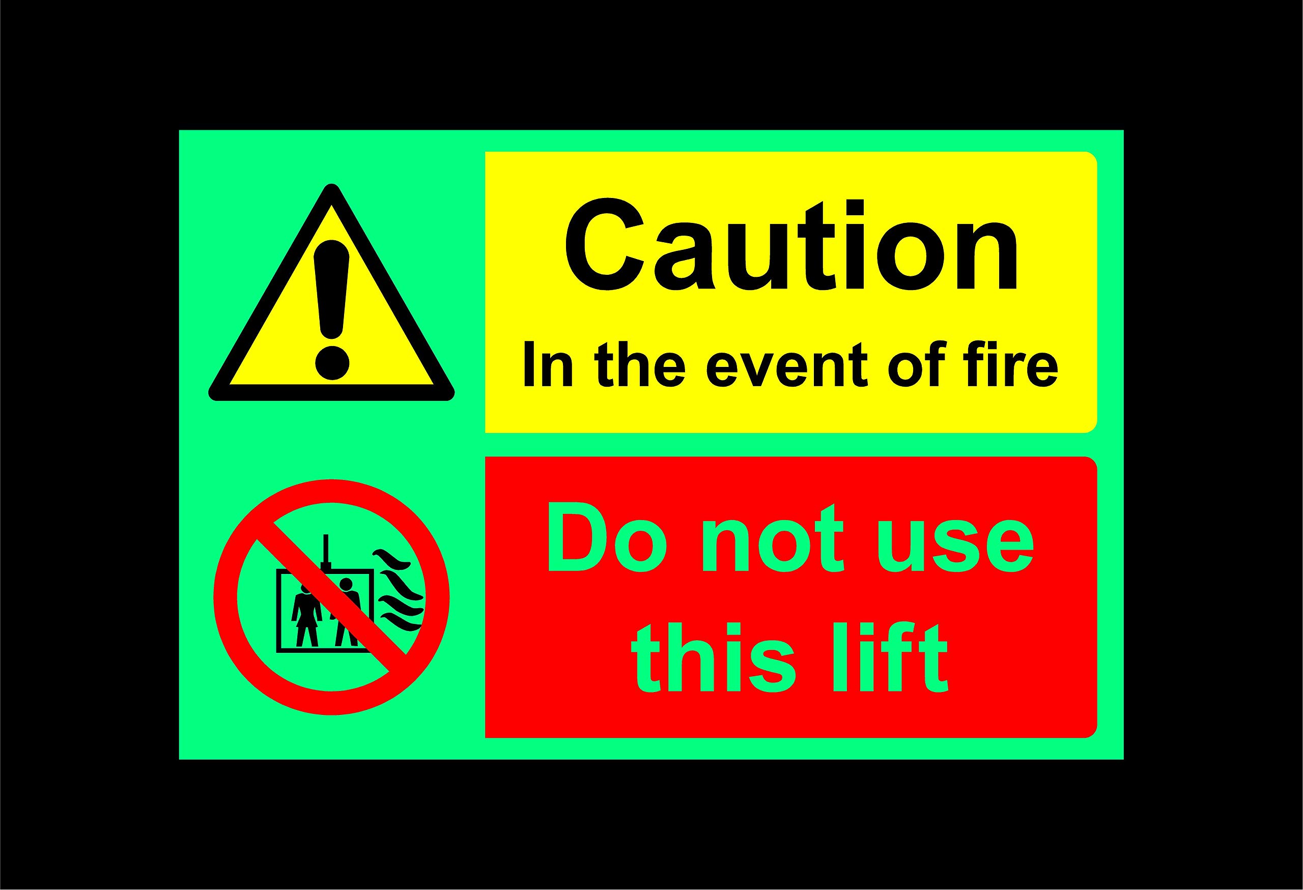 Caution in the event of fire do not use this lift Safety sign - 1.2mm Photoluminescent glow in the dark rigid plastic with self adhesive backing 200mm x 150mm