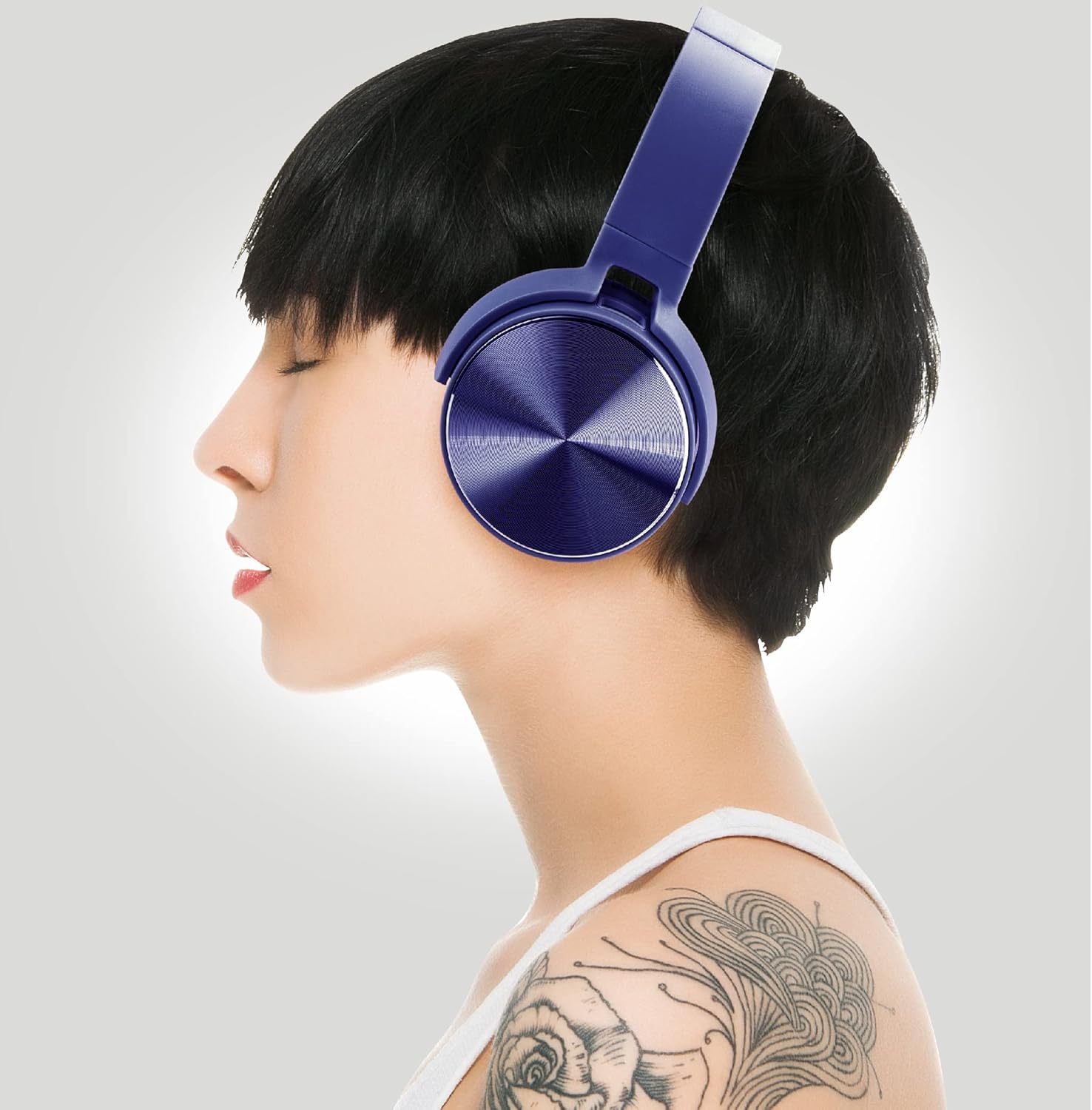 Woman wearing Coby headphones in side profile