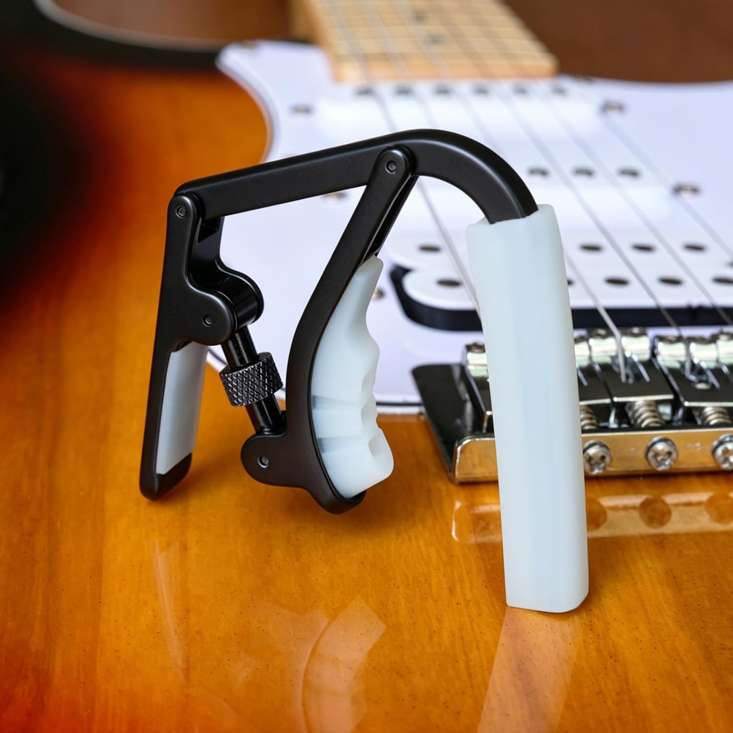 Guitar Capo for Acoustic and Electric Guitars - Adjustable Capo with Memory Tension- Black with White Glow-in-the-Dark Silicone