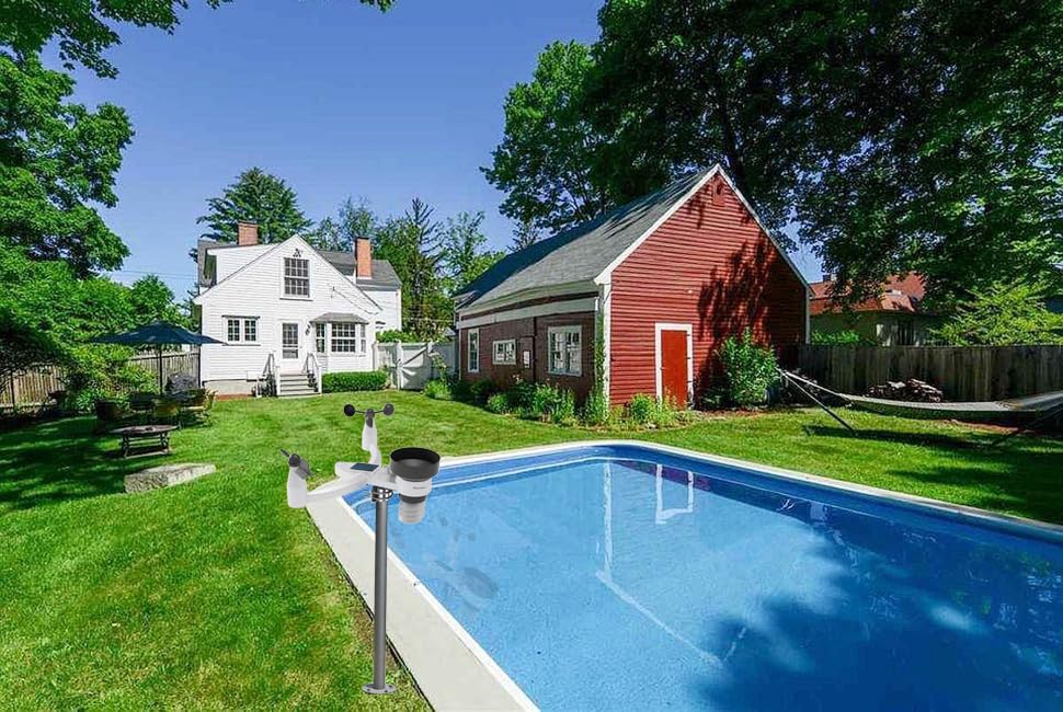 YuqiaoTime 0370 WiFi Weather Station installed in a backyard next to a swimming pool, demonstrating outdoor placement.