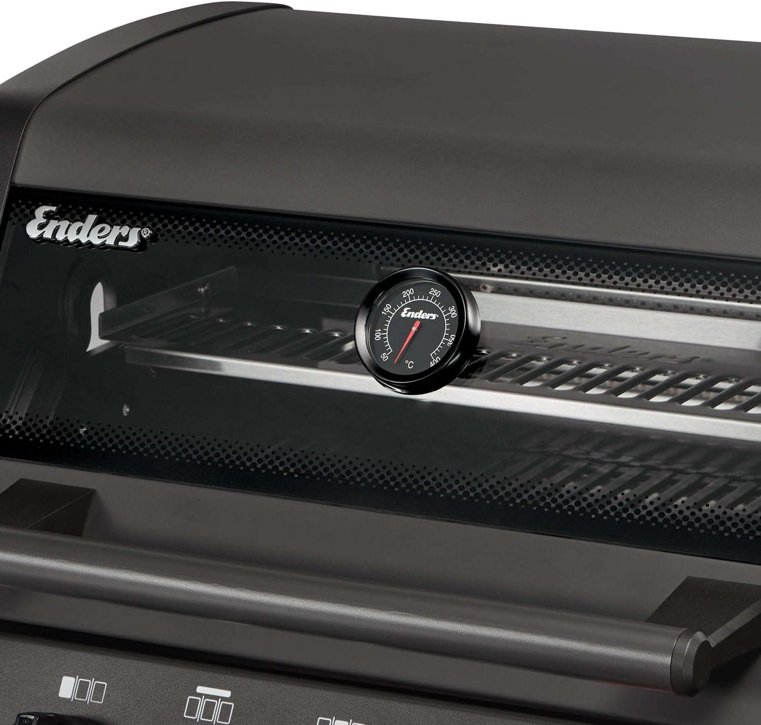 Close-up of the Enders barbecue lid, showing the PANOVISION viewing window and an integrated thermometer displaying the internal temperature.