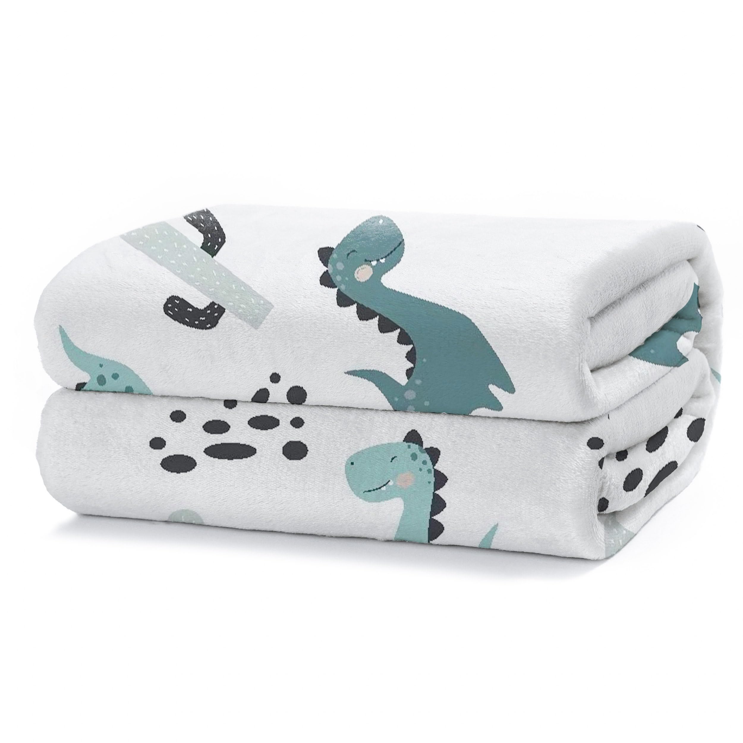 HOMEYA - Manta Sofa Pequeña 130 x 160 - Manta Infantil para Cama. Manta Polar, Franela 100% Poliéster, Suave, Acabado con Brillo - Dinosaurio Blanco