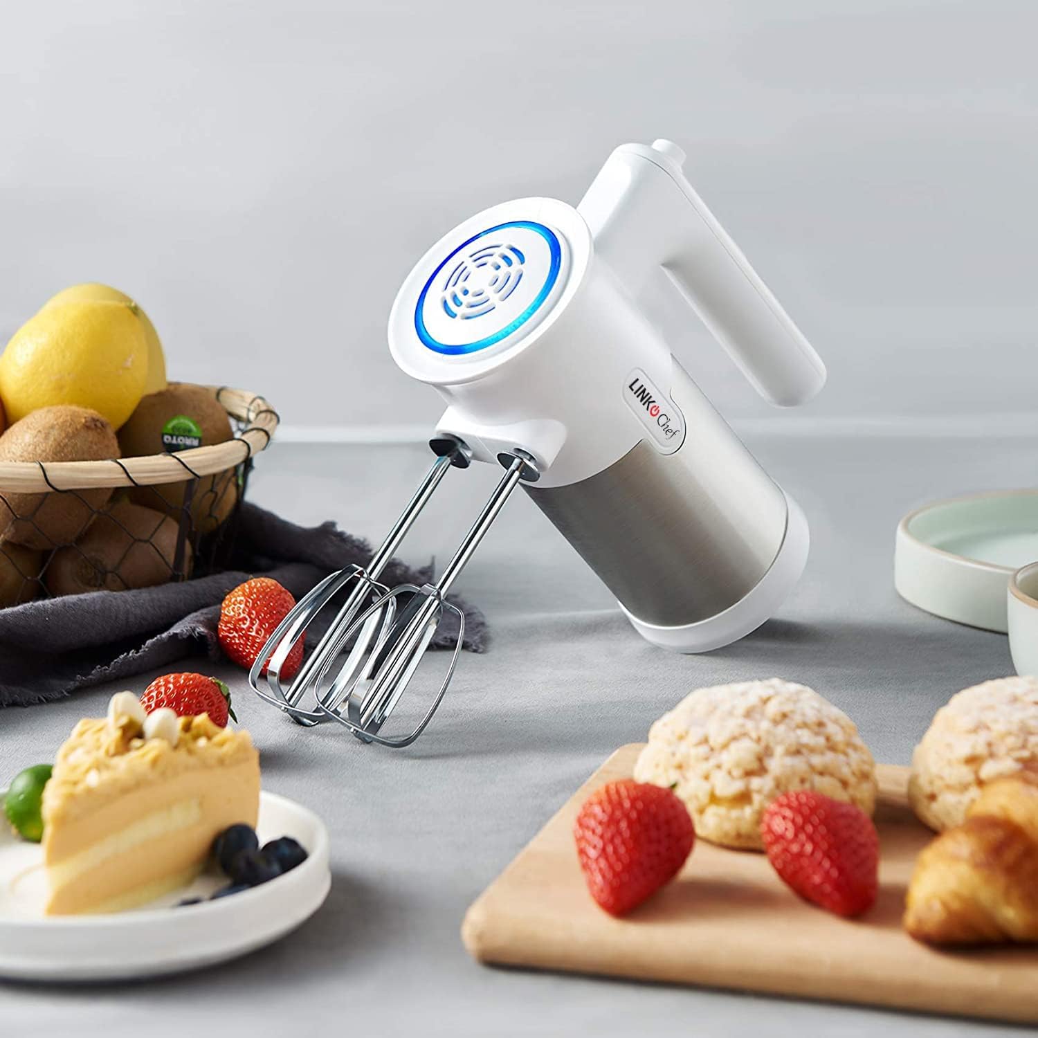 Person using LINKChef HM-1020 Hand Mixer to mix ingredients in a bowl