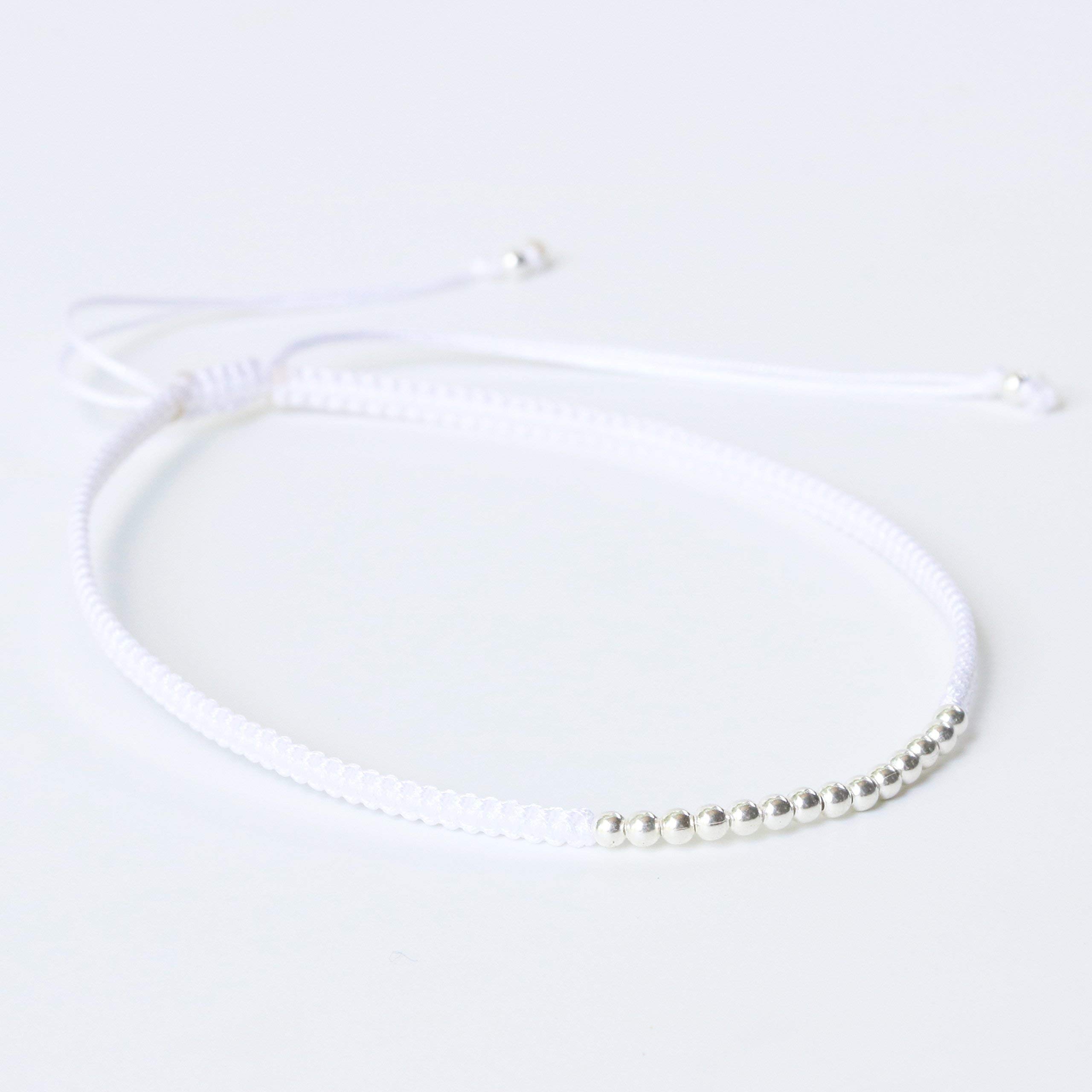 Adjustable friendship bracelet in cotton string and sterling silver beads at the center(White)
