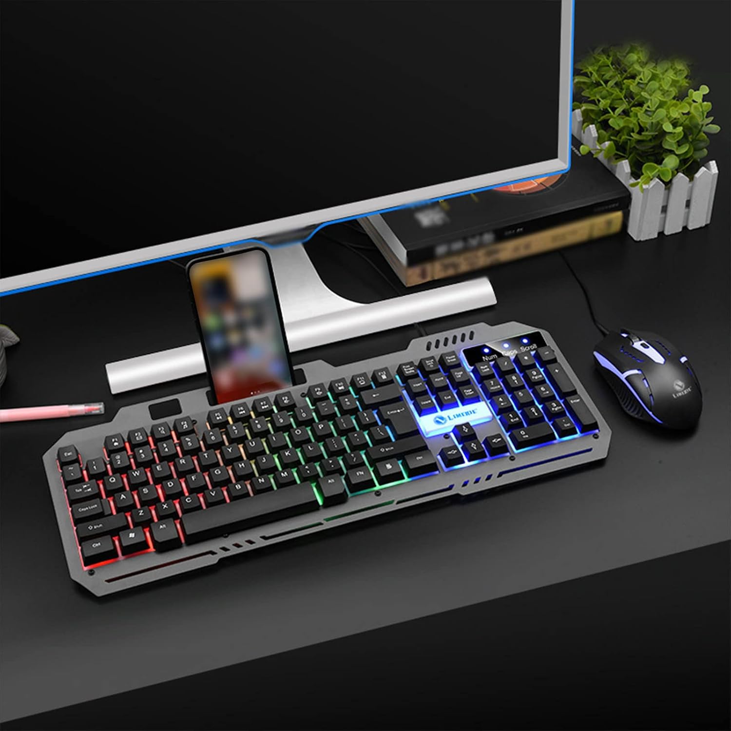 CENGNIAN T25 Keyboard and Mouse Combo connected to a computer with a phone in the holder