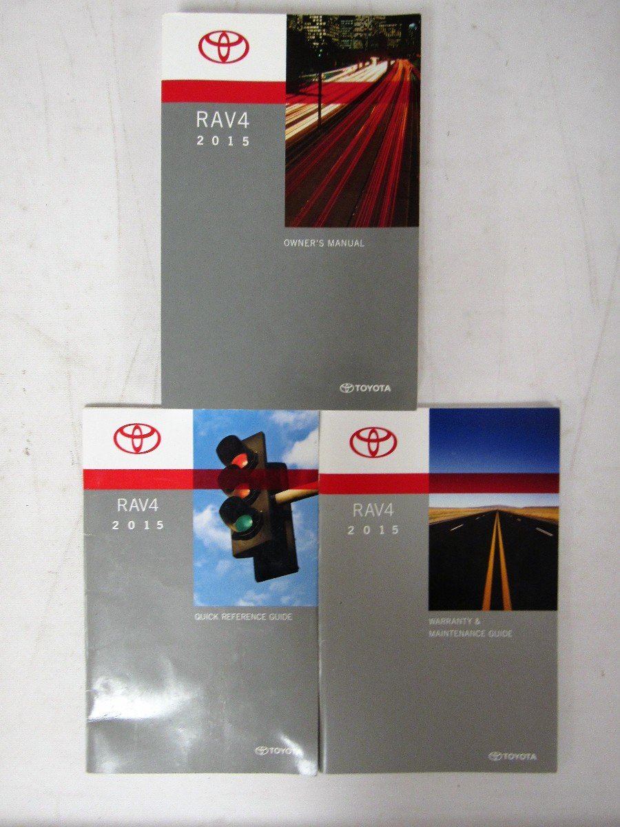 Set of 2015 Toyota RAV4 manuals including Owner's Manual, Quick Reference Guide, and Warranty & Maintenance Guide