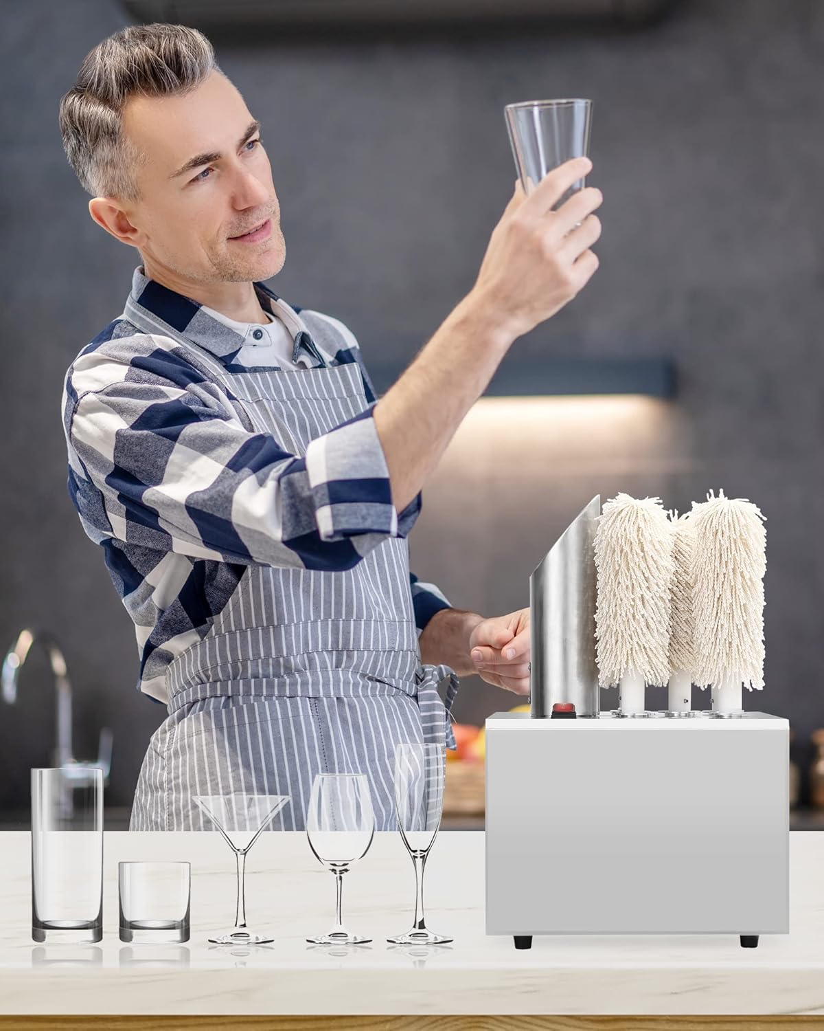 Man inspecting a freshly polished glass for clarity