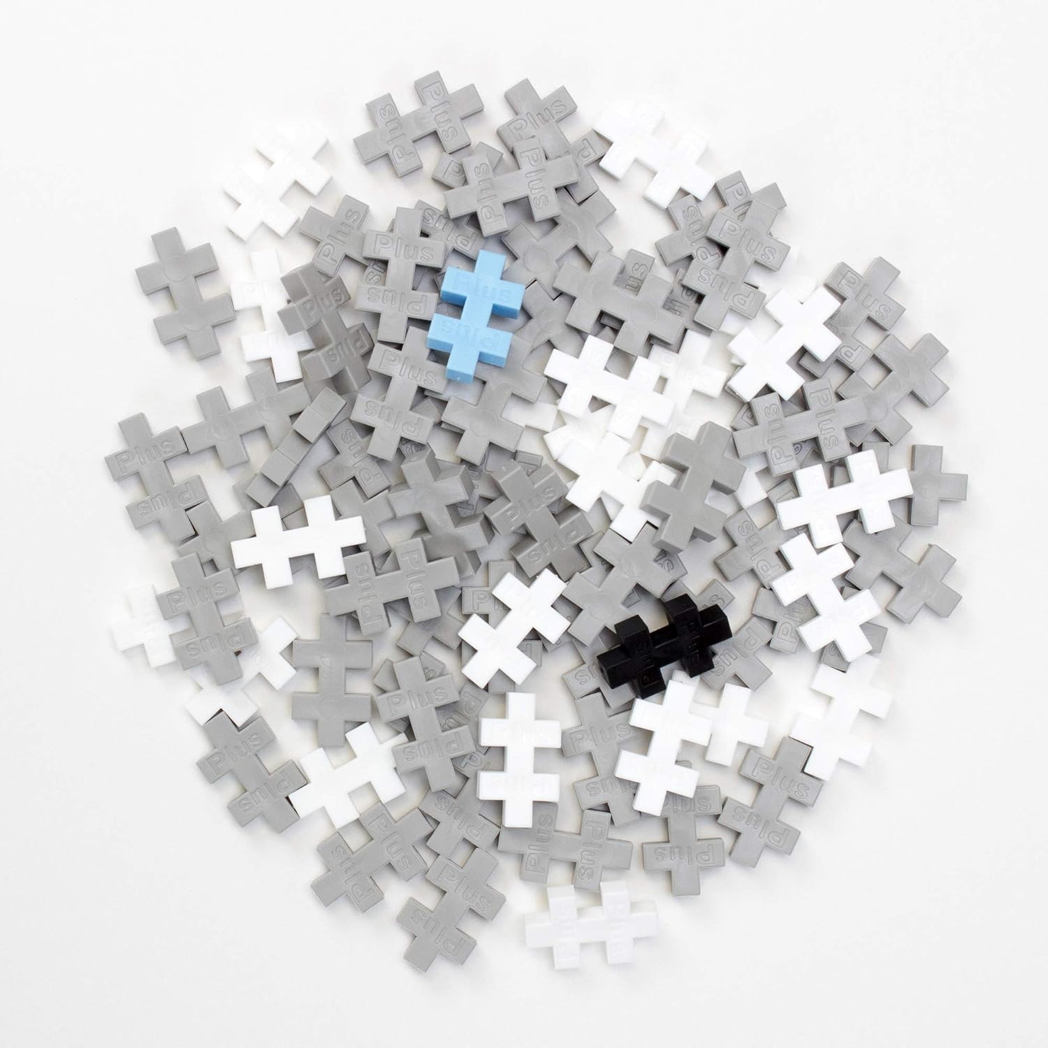 Pile of various colored PLUS PLUS pieces