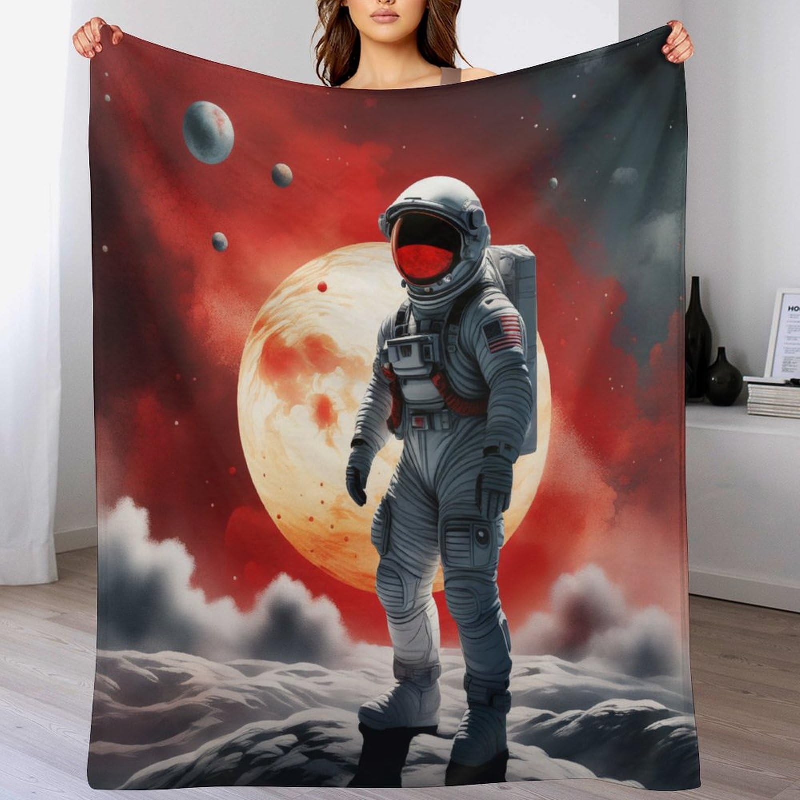 Couverture space astronaute chaude et legere contre les nuits fraiches au lit