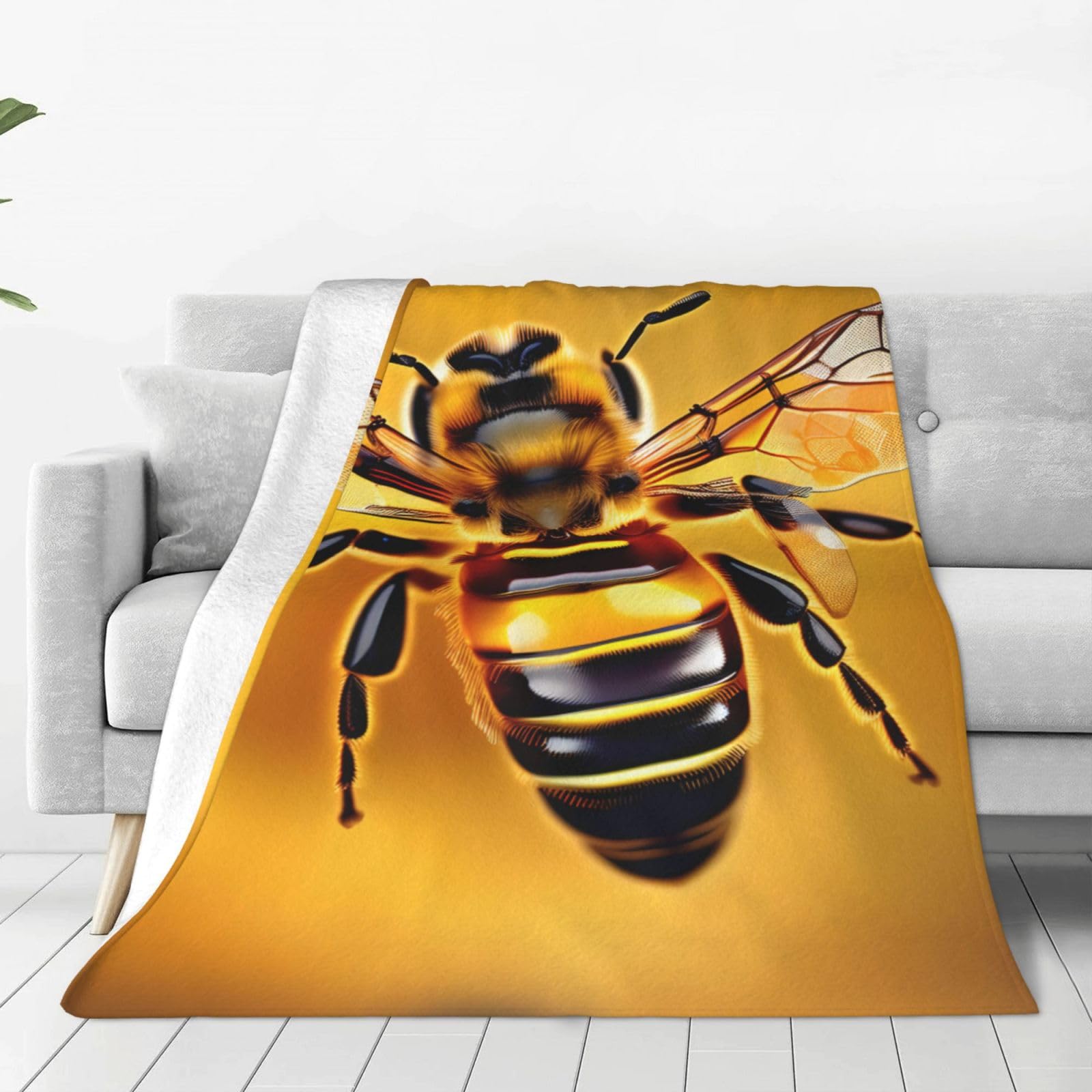 Couverture polaire douce motif abeille pour cocooning sur le canapé