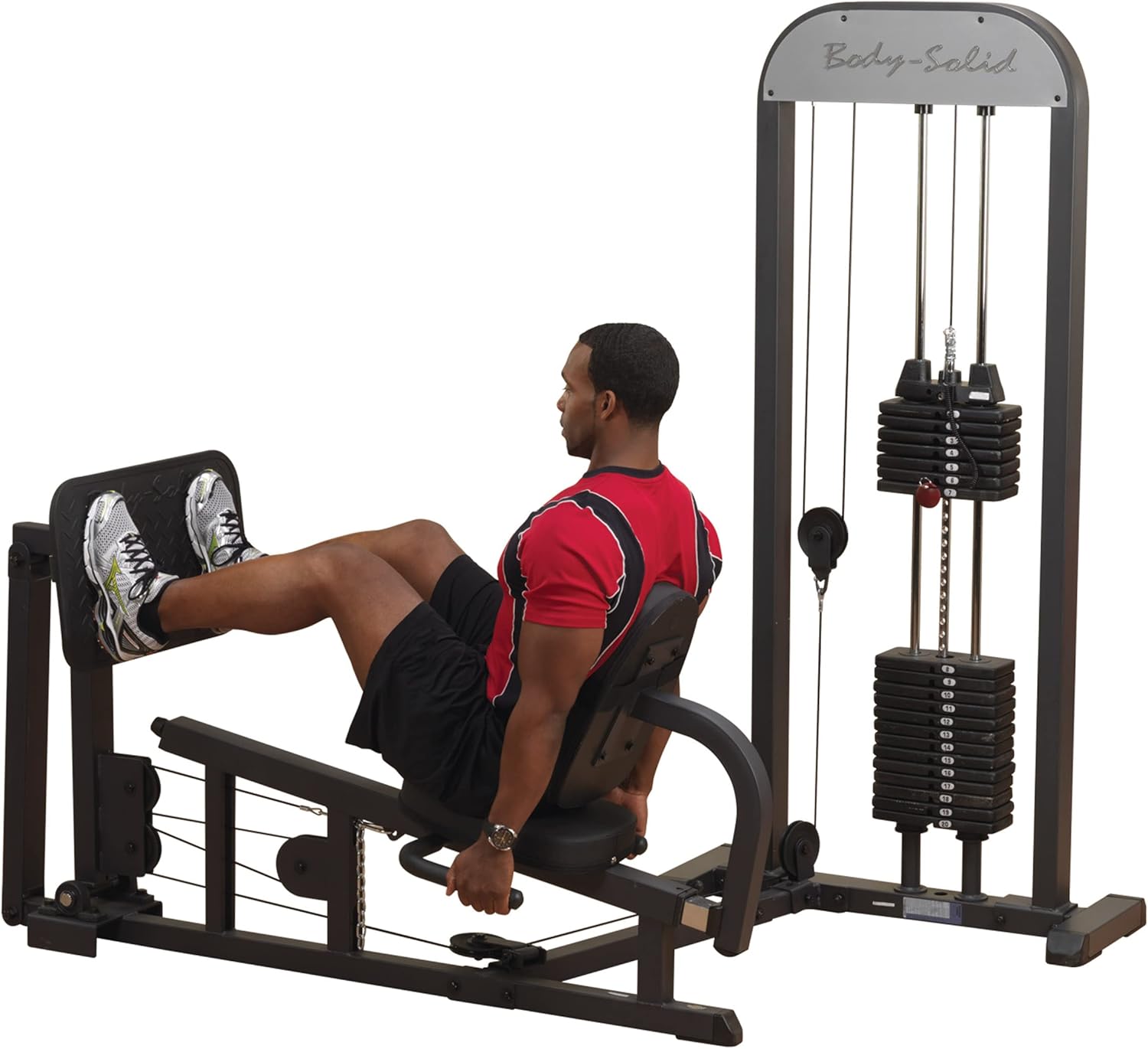 User performing leg press on machine