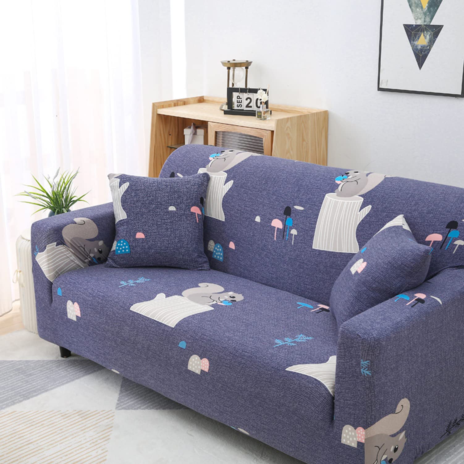 Housse de canapé extensible imprimée pour protéger un fauteuil usé