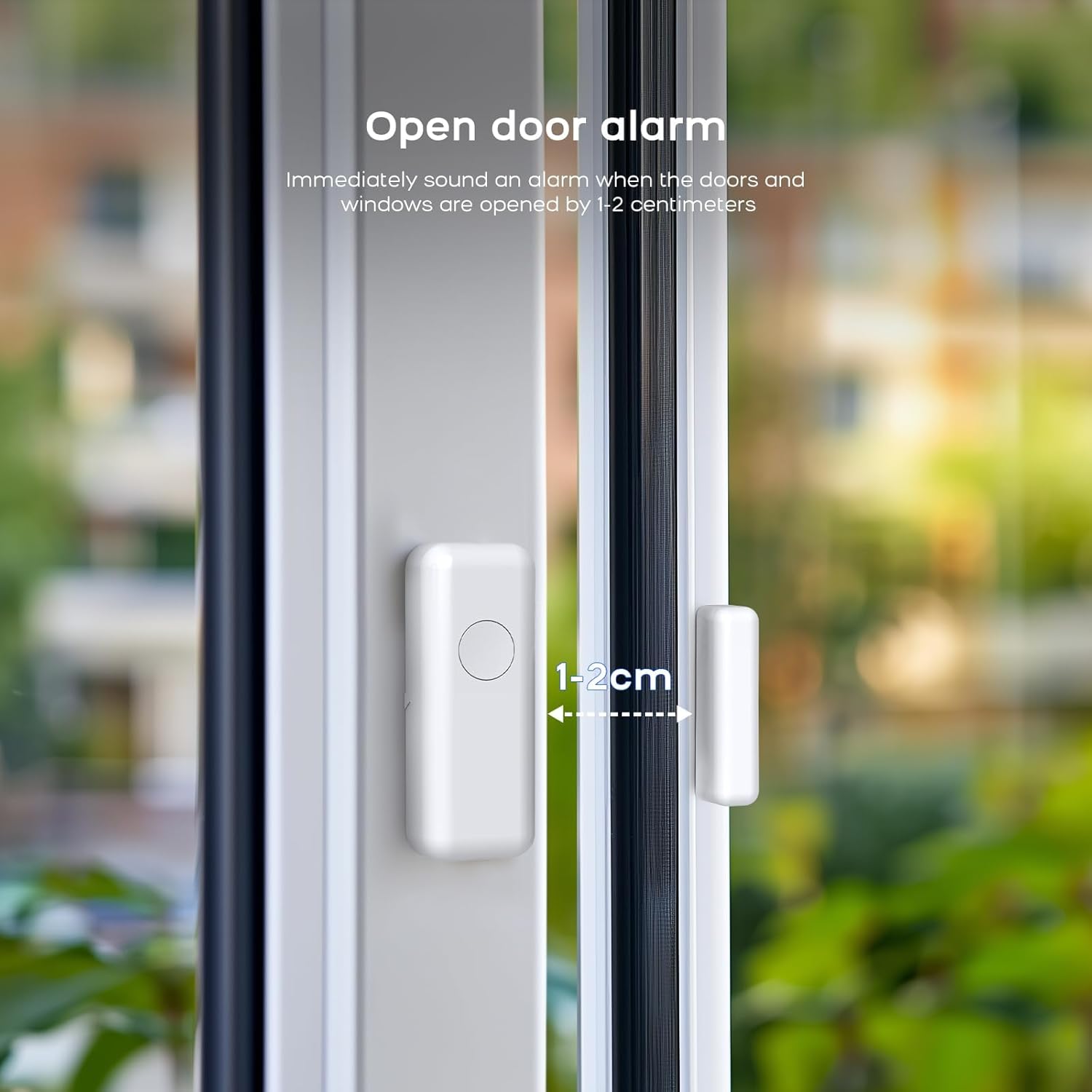 Close-up of a door sensor installed on a window frame, showing the 1-2 cm gap for triggering.