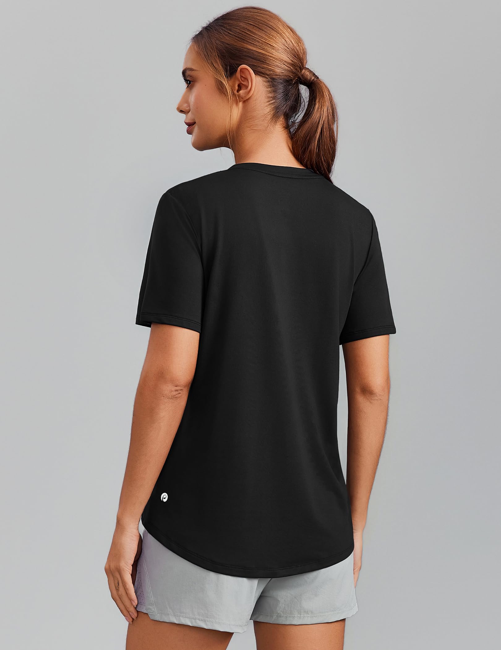 Close-up of the PINSPARK V-neck workout top fabric showing its texture and breathability.