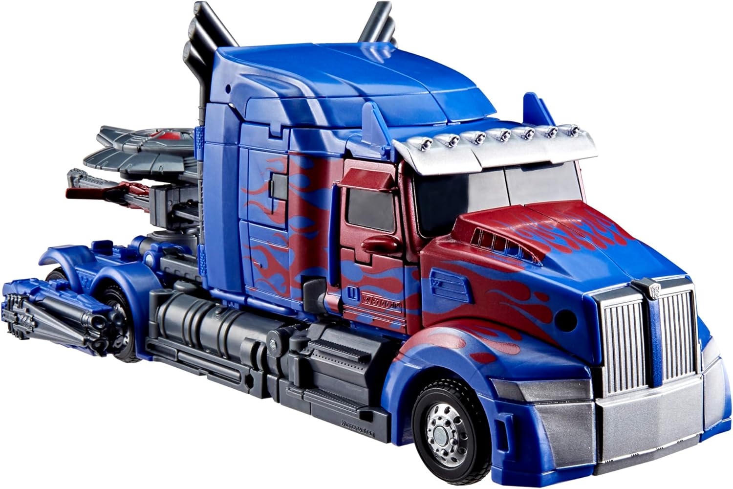 Transformers Studio Series Nemesis Prime in its dark blue and red truck vehicle mode, viewfra en lille vinkel.