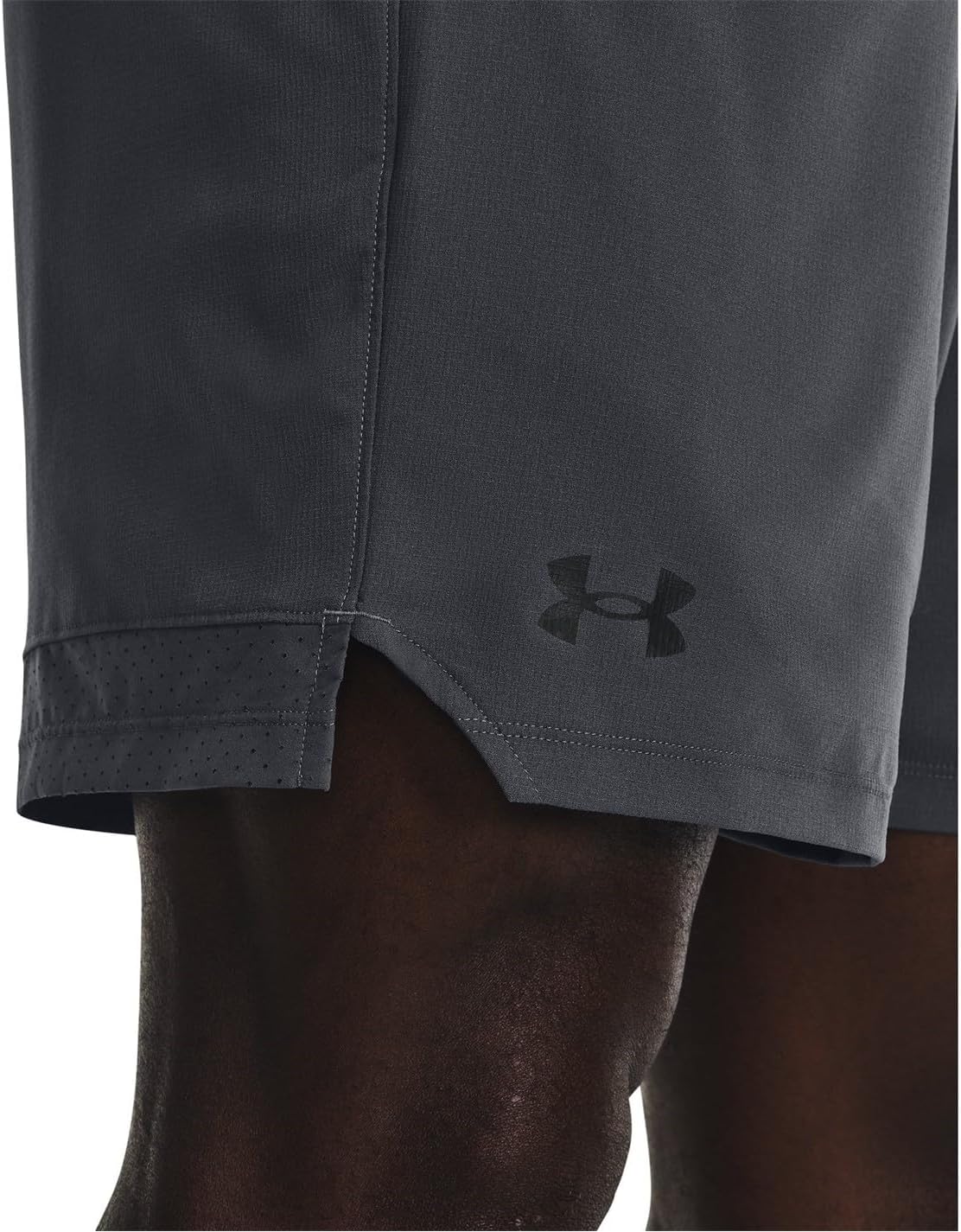 Close-up of the side split hem and perforated detail on the Under Armour shorts