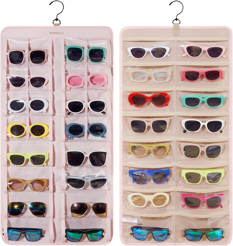BAGSMART Organizador de joyas para colgar, estuche de almacenamiento para lentes de sol a prueba de polvo, montado en la pared, estuche para lentes de viaje de doble cara, varios pares, soporte para lentes con 32 ranuras transparentes y gancho de metal, rosa