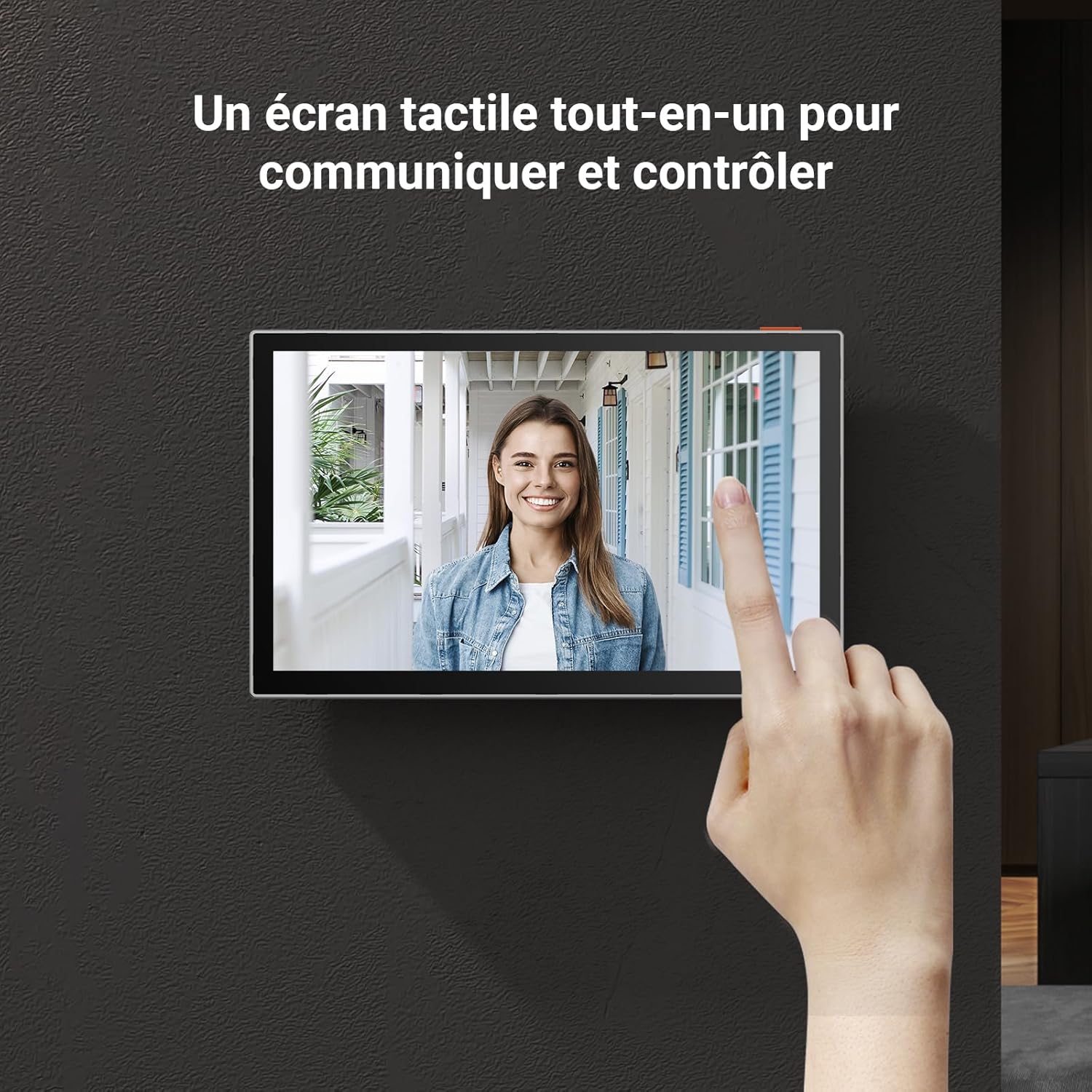 A hand interacting with the 7-inch touch screen monitor, displaying a live video feed.