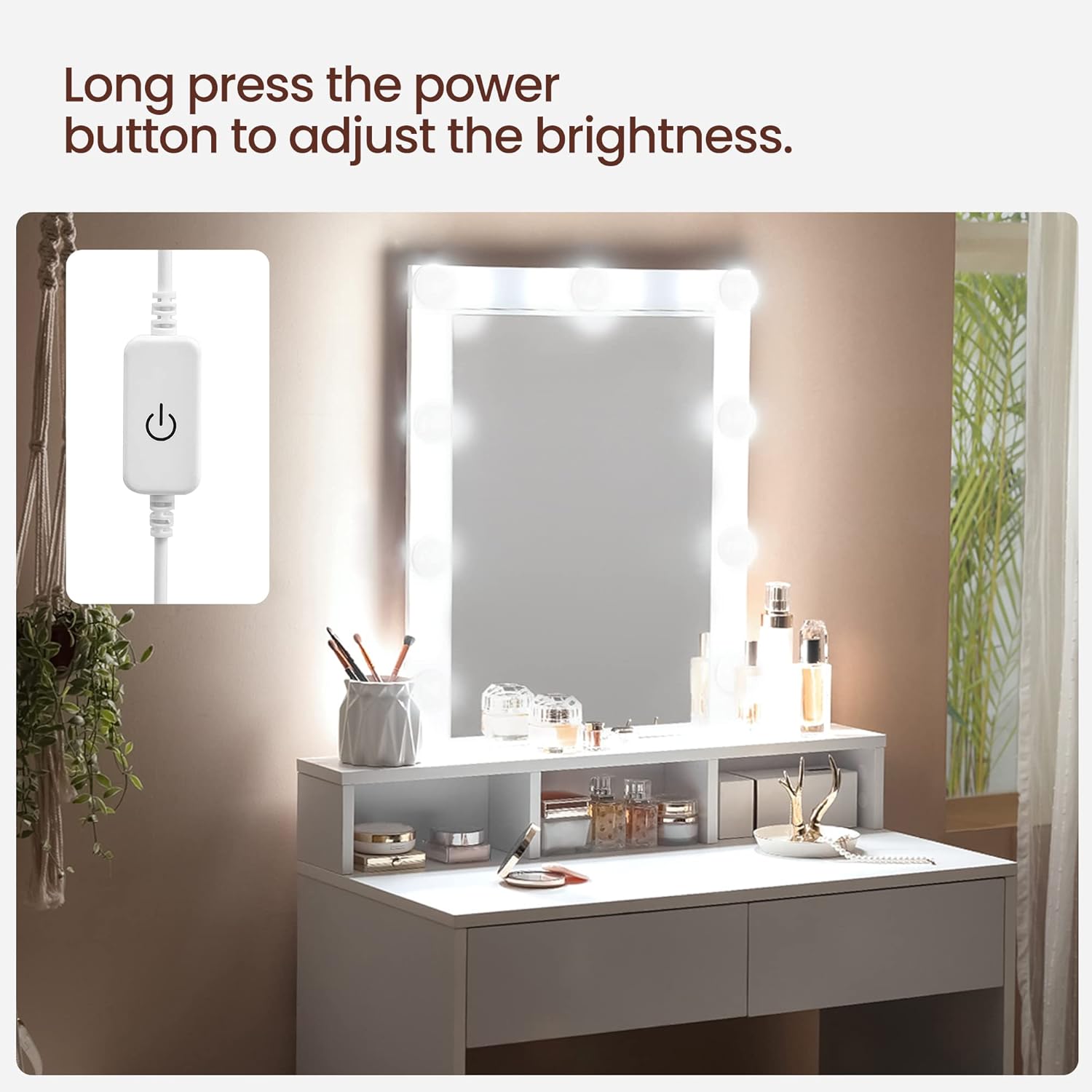 Close-up of the LED light power button and brightness adjustment switch for the VASAGLE dressing table.