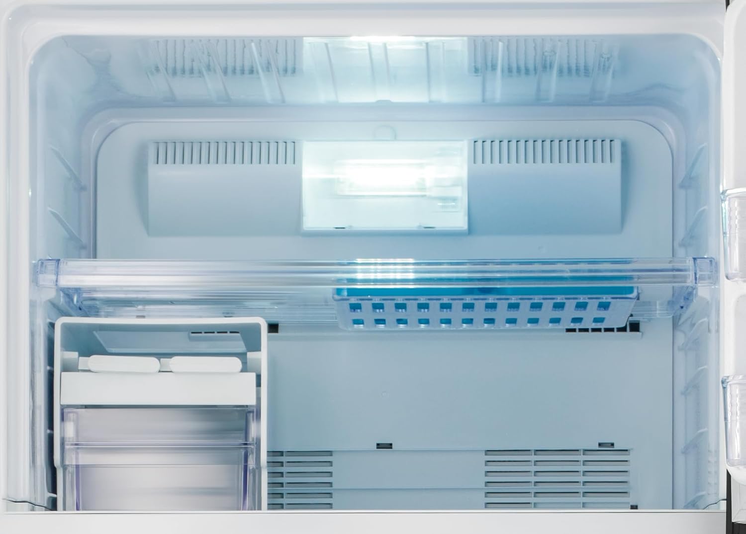 Close-up of the 'HYBRID COOLING SYSTEM' label inside the refrigerator compartment.