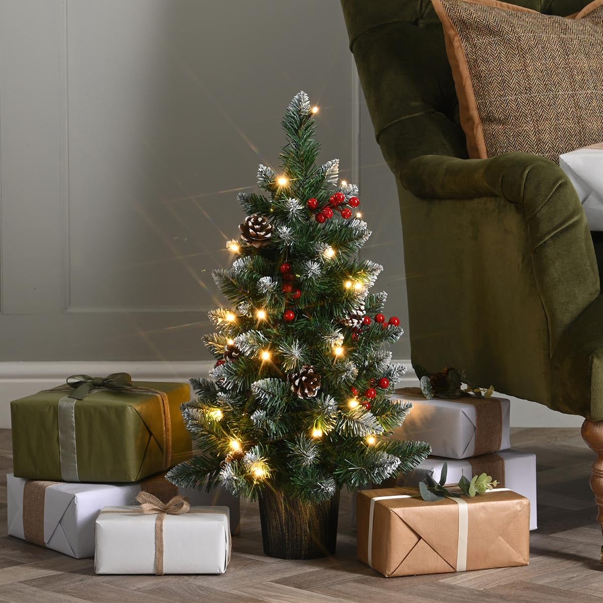 Festive Lights - 2ft 60cm Prelit Green Potted Christmas Tree - 24 Warm White LEDs, Pinecones, Berries, 8 Functions, 63 PVC Tips, Battery Powered Compact Seasonal Decoration for Home, Office, Bedroom