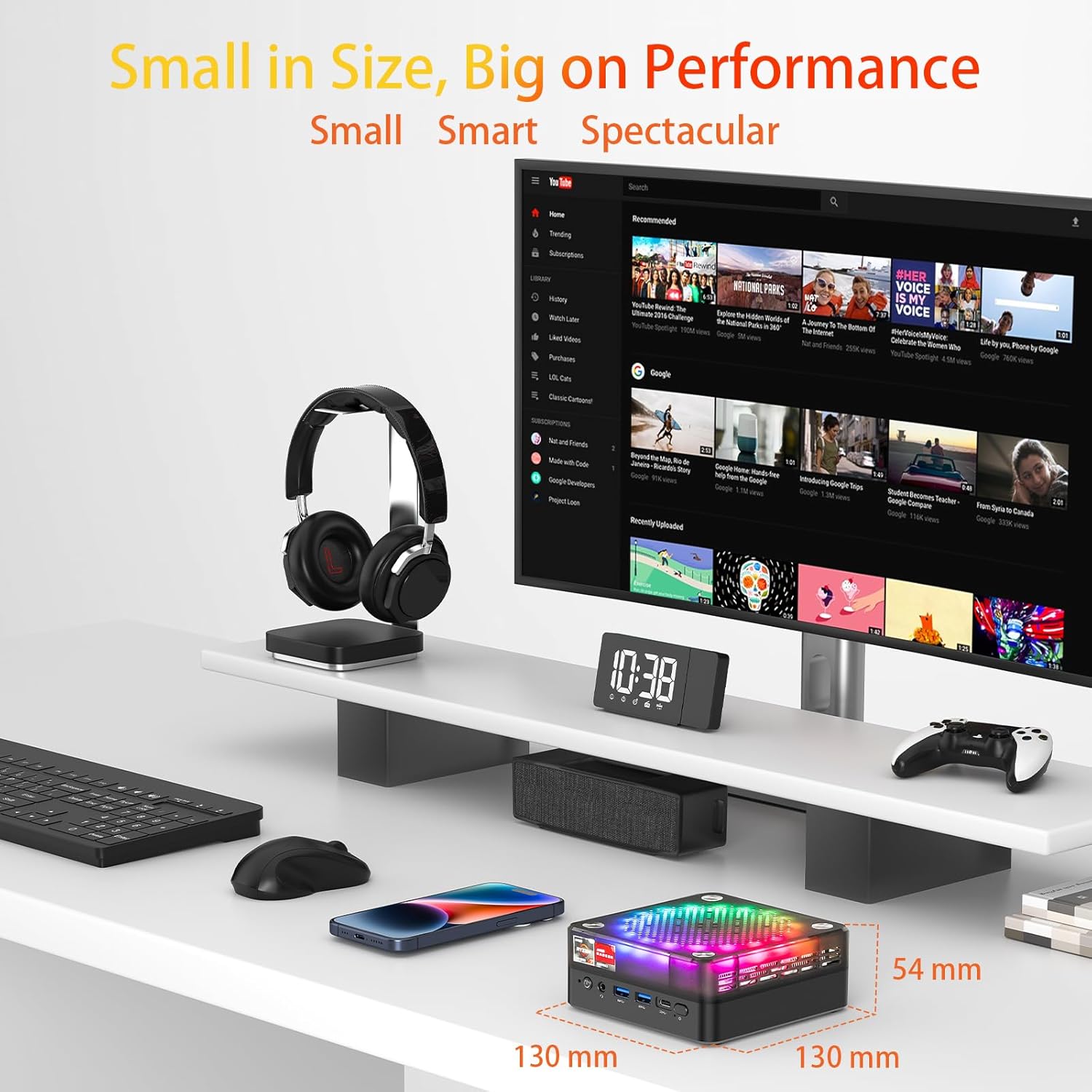 AWOW HA7 Mini PC placed on a desk next to a monitor, keyboard, mouse, and smartphone, emphasizing its compact dimensions (130mm x 130mm x 54mm).