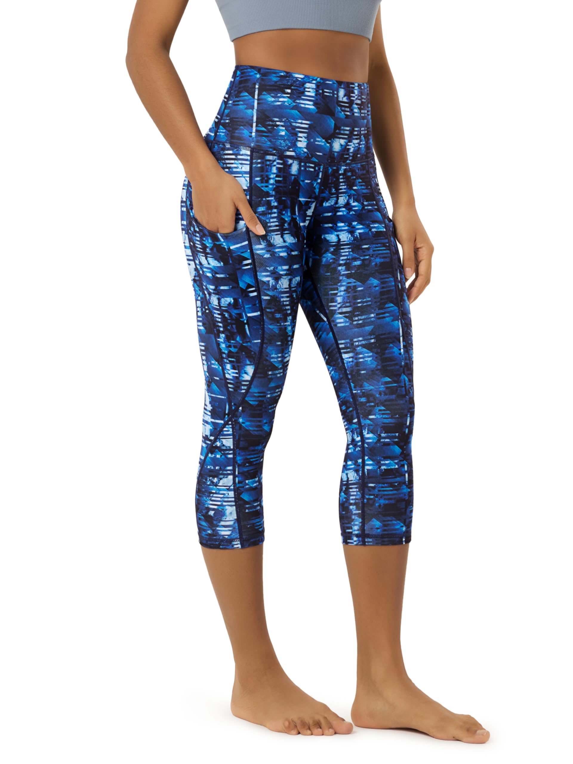 ODODOS Women's High Waisted Yoga Capris with Pockets, Tummy Control Non See Through Workout Athletic Running Capri Leggings