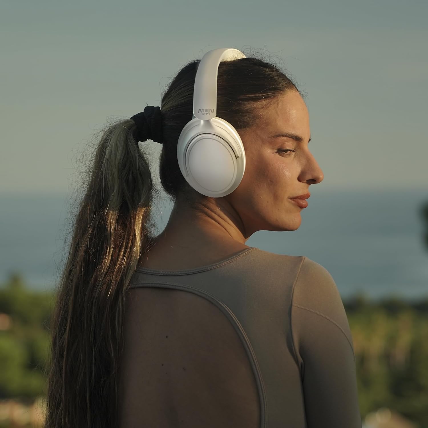 Person wearing Vieta Pro Silence 4 headphones outdoors