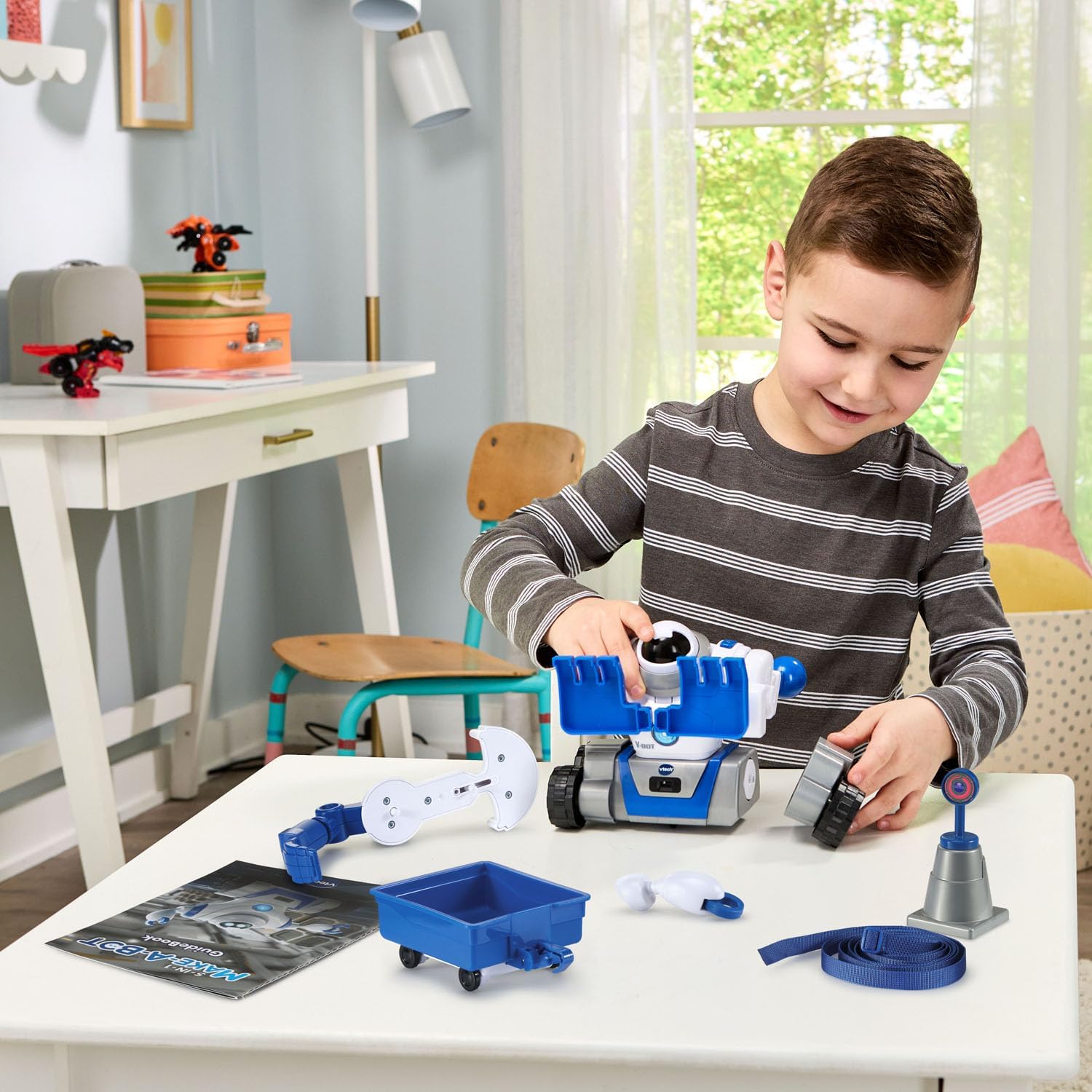 Child assembling V-Bot with various parts