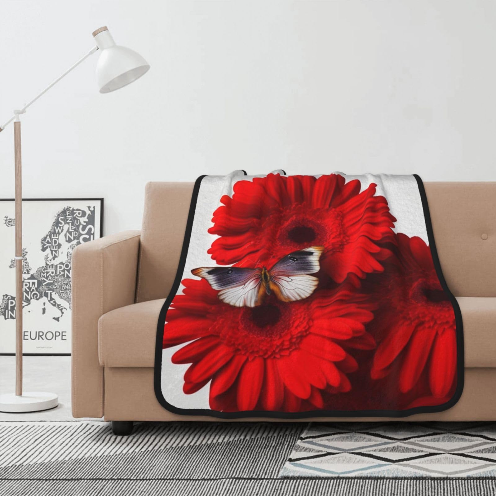 Couverture polaire papillon rouge pour vos soirées cocooning et moments de détente sur le canapé
