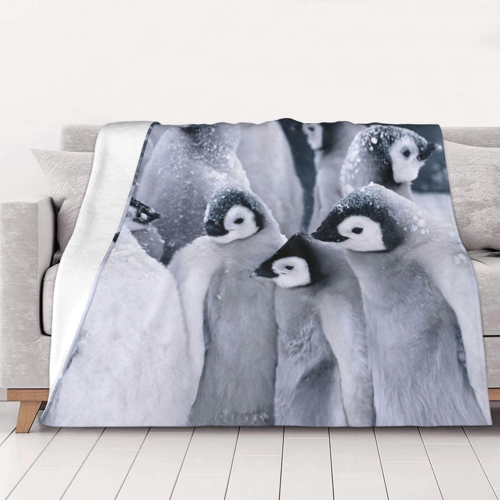 Couverture en flanelle pingouin contre le froid du lit au salon