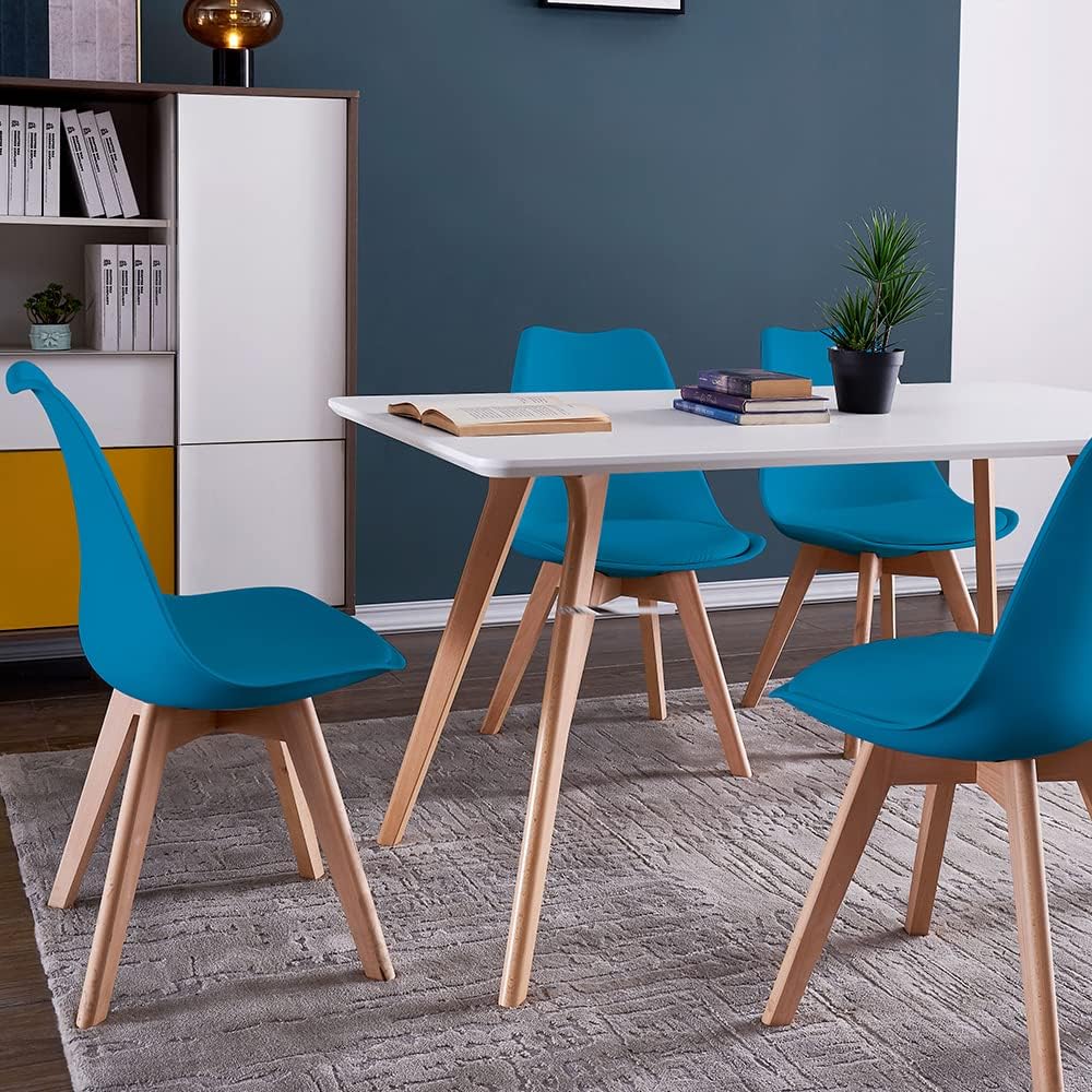 Four blue DEWINNER dining chairs arranged around a white dining table in a modern dining room setting.