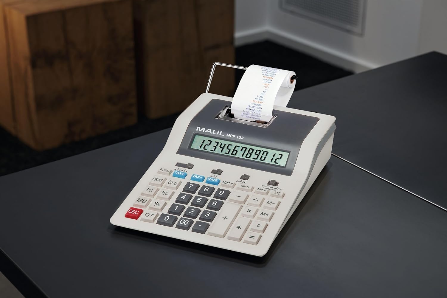 MAUL Desktop Calculator Printing MPP 123 on a desk with a paper roll