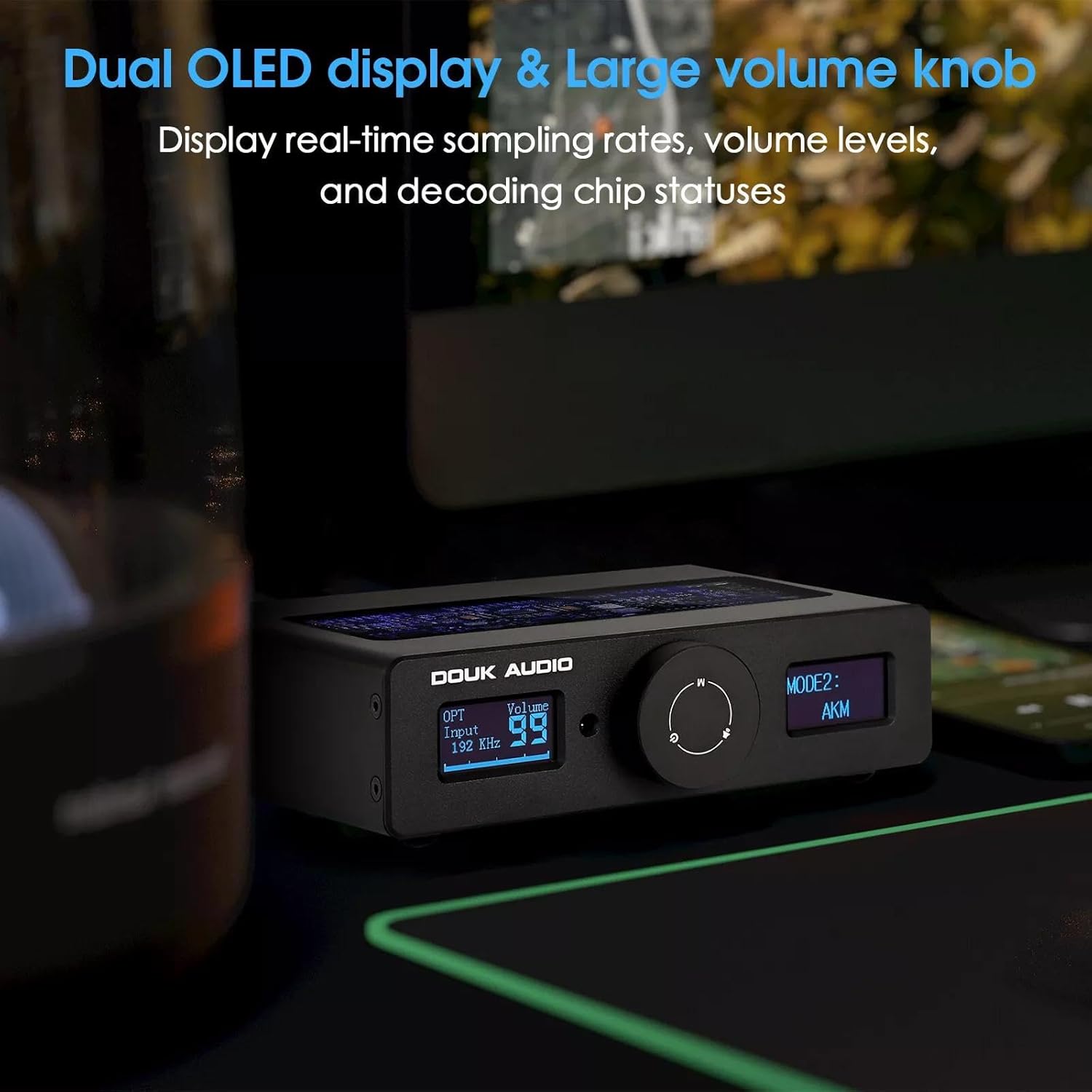 Douk Audio Q11 DAC with a close-up of the dual OLED display and large volume knob.