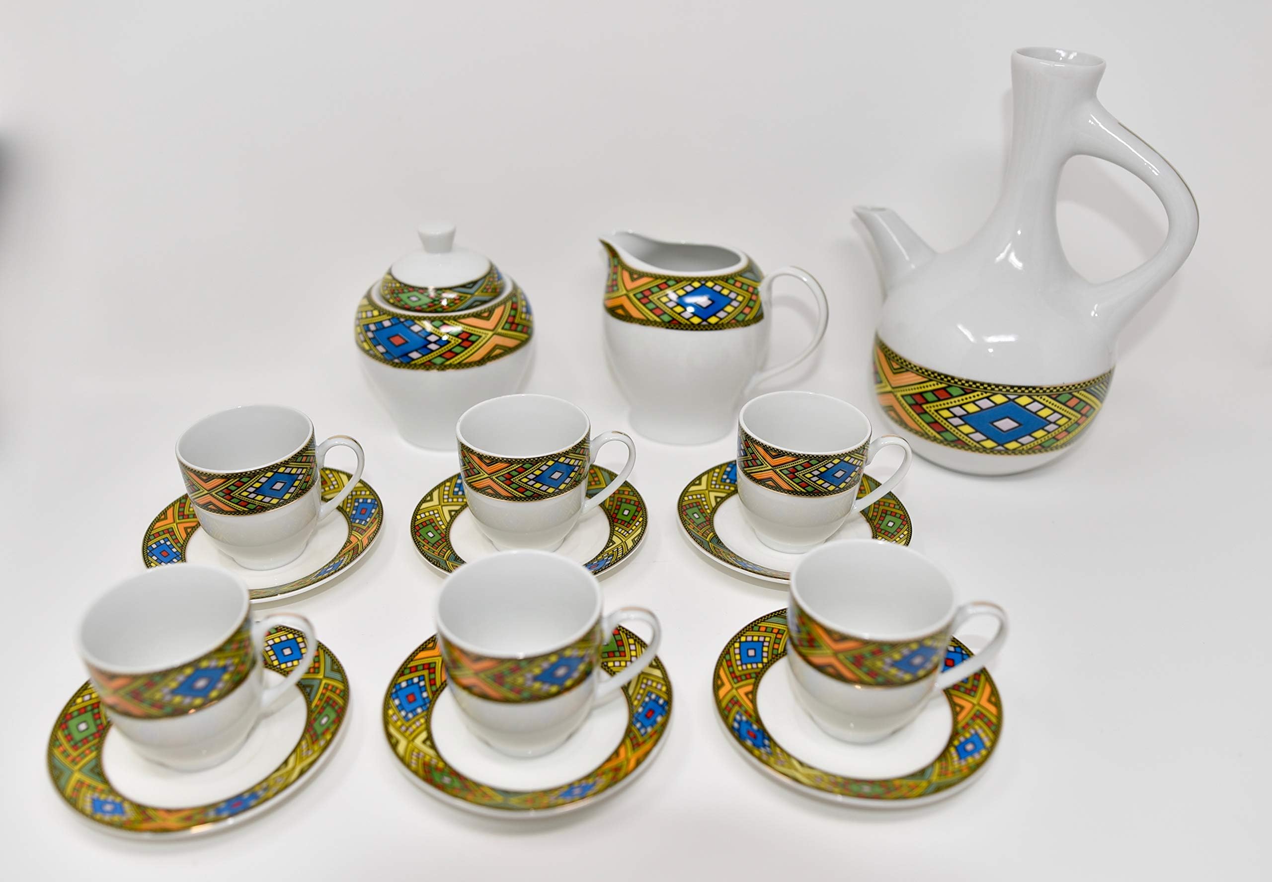 Ethiopian/Eritrean Coffee Cups with Rékébot, Tilét Edition. Set of 12. Comes with 6 cups, 6 saucer, 1 Creamer bowl, and 1 sugar bowl. (Tilét)