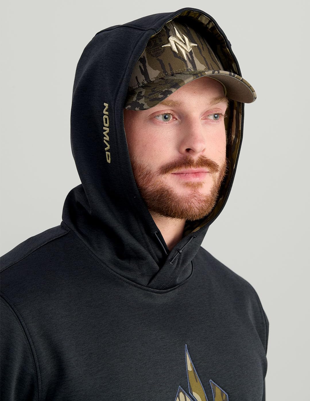 Nomad Men's Standard North Star, Comfortable Midweight Hunting Hoodie with Camo Logo for Everyday and Outdoor Lifestyle, Black/Mossy Oak Bottomland