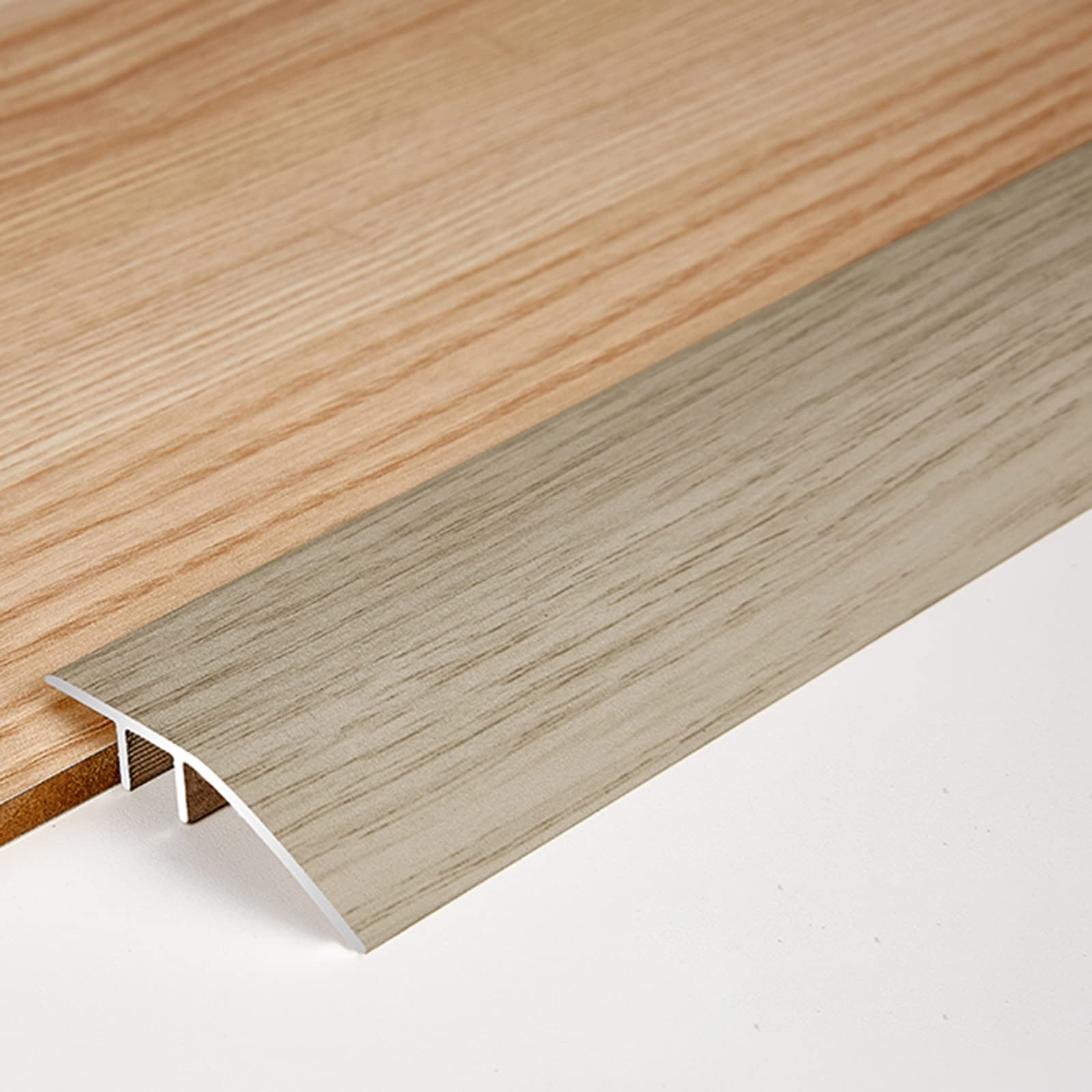 Barre de transition de plancher pour jonction tapis carrelage et sol inégal
