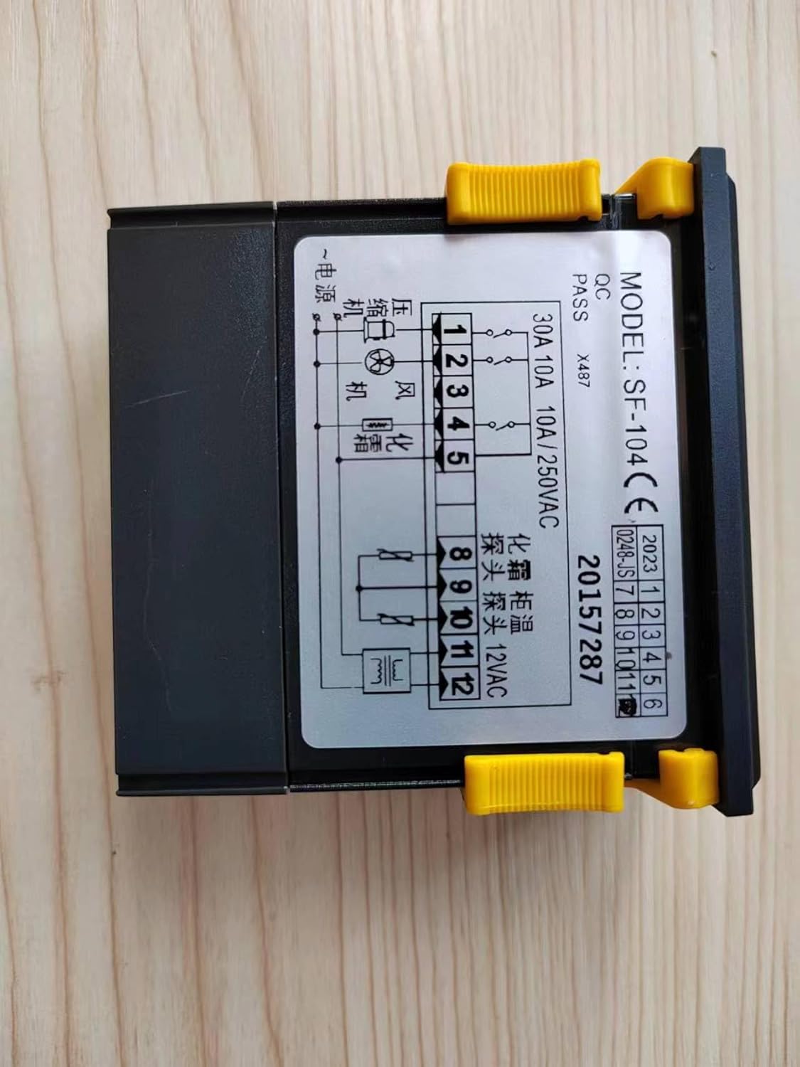 Front view of the SF-104 Temperature Controller showing the digital display and wiring diagram.