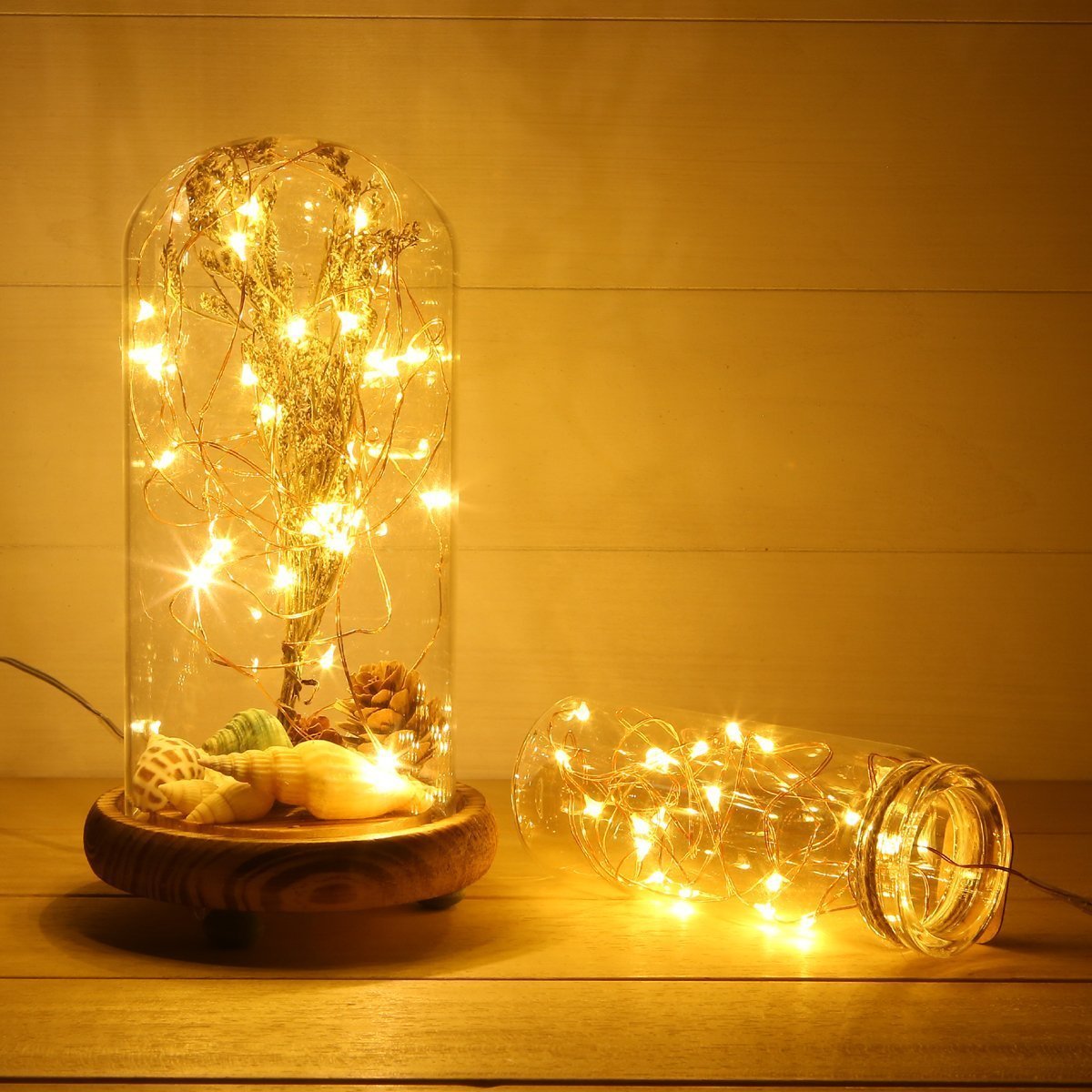 Living room lit with warm lamps and fairy lights.
