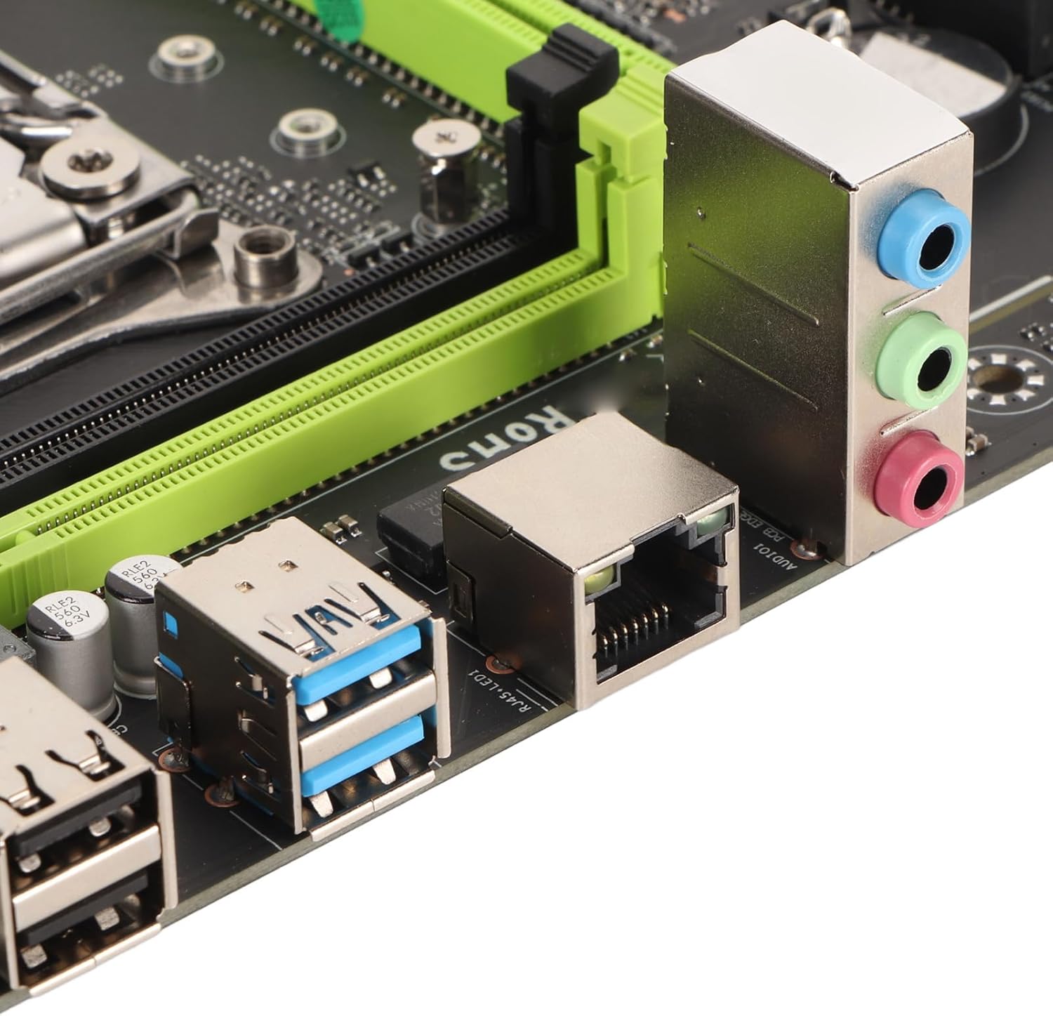 Close-up of the rear I/O panel of the Tangxi X99 P4 Motherboard, featuring PS/2, USB, RJ45 Ethernet, and audio jacks.