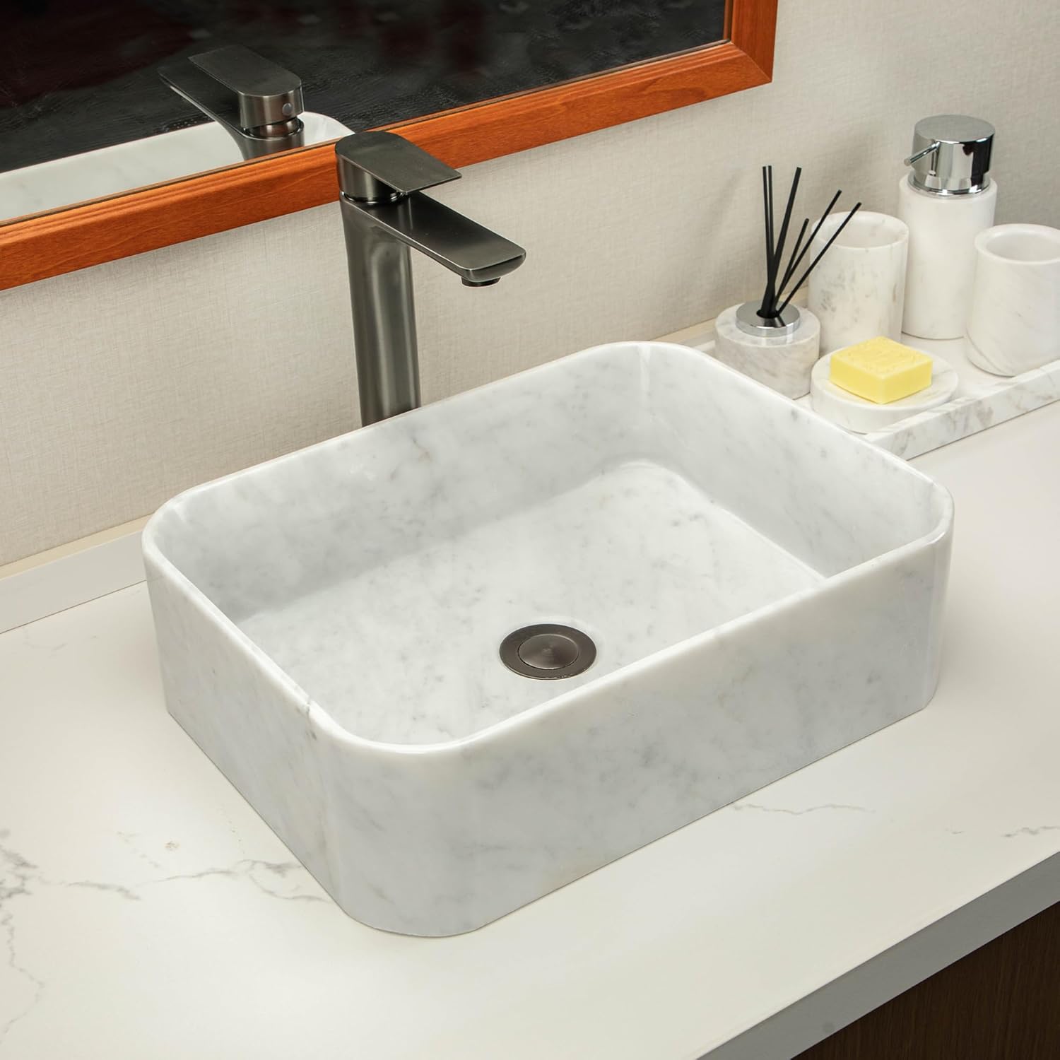 White square stone sinks made of natural Carrara white marble with irregular gray veining create an elegant and sophisticated bathroom vanity or countertop.