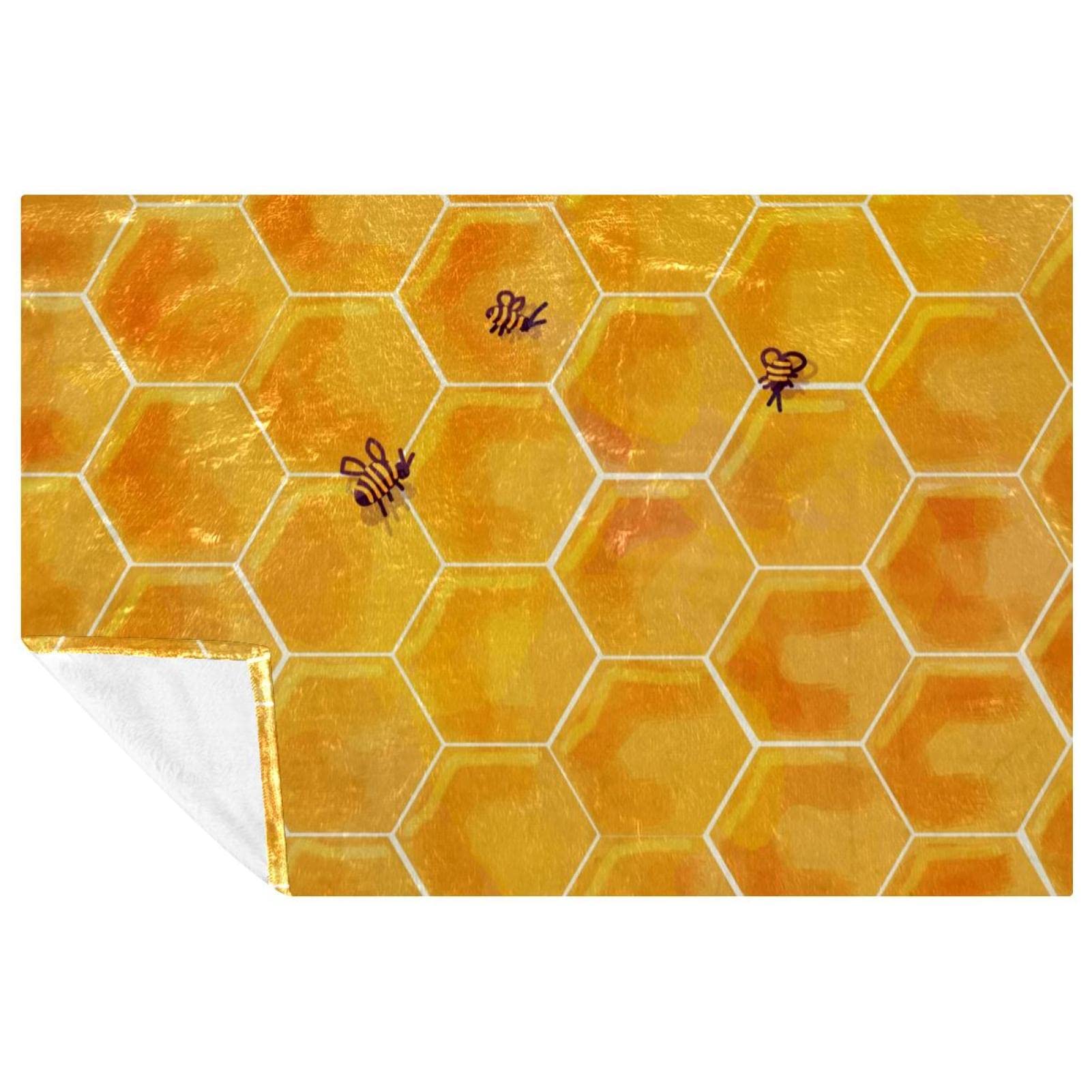 Couverture nid d'abeille bio contre le froid sur le canapé ou au lit