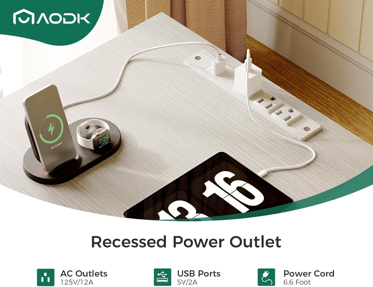 Close-up of the recessed power outlet on the desk surface with devices charging.