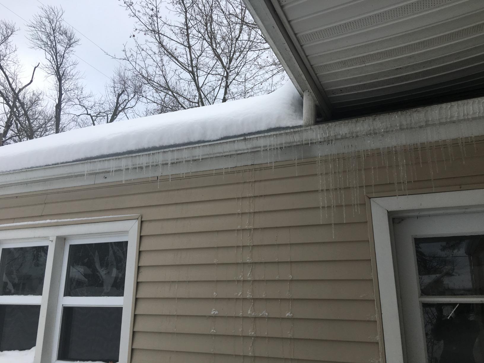 EasyHeat deicing cable installed in a gutter with water flowing