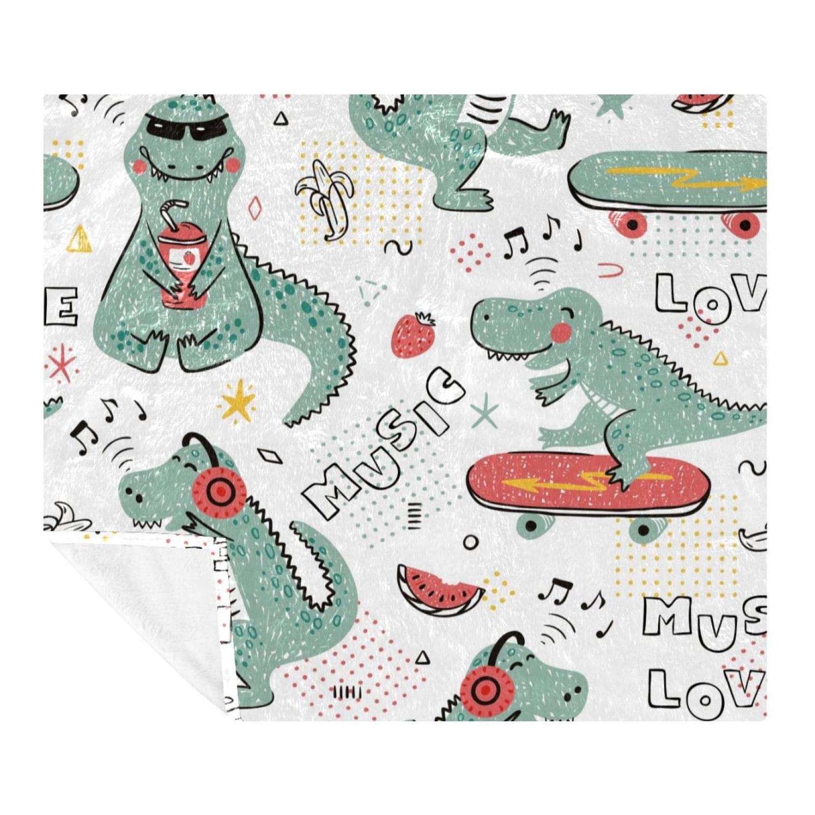 Couverture dinosaure en polaire pour des soirées cocooning en famille sur le canapé