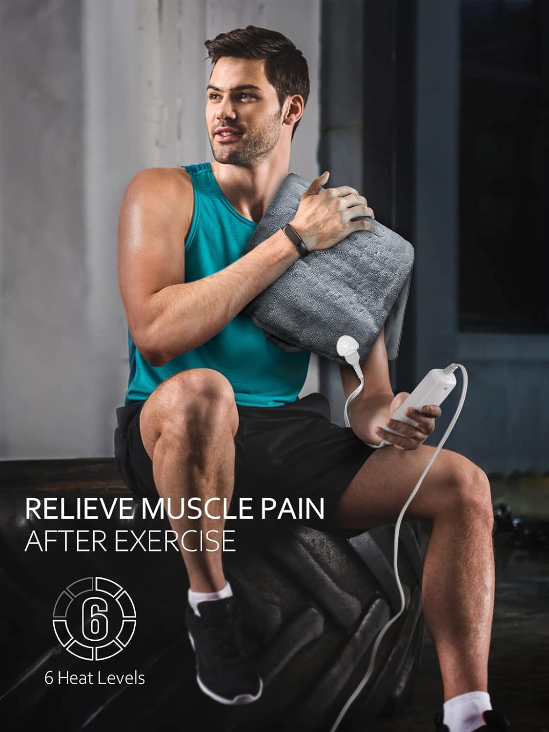 Man using heating pad on shoulder for pain relief