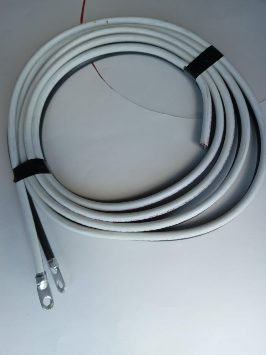 1/0 AWG 12' Heavy Duty Battery Cables Block and White Color with 3/8 Inch lugs one end Other Ends Open for Solar Marine RV Car Truck Tractor Motorcycle. Battery Cables are Made of Pure Copper.