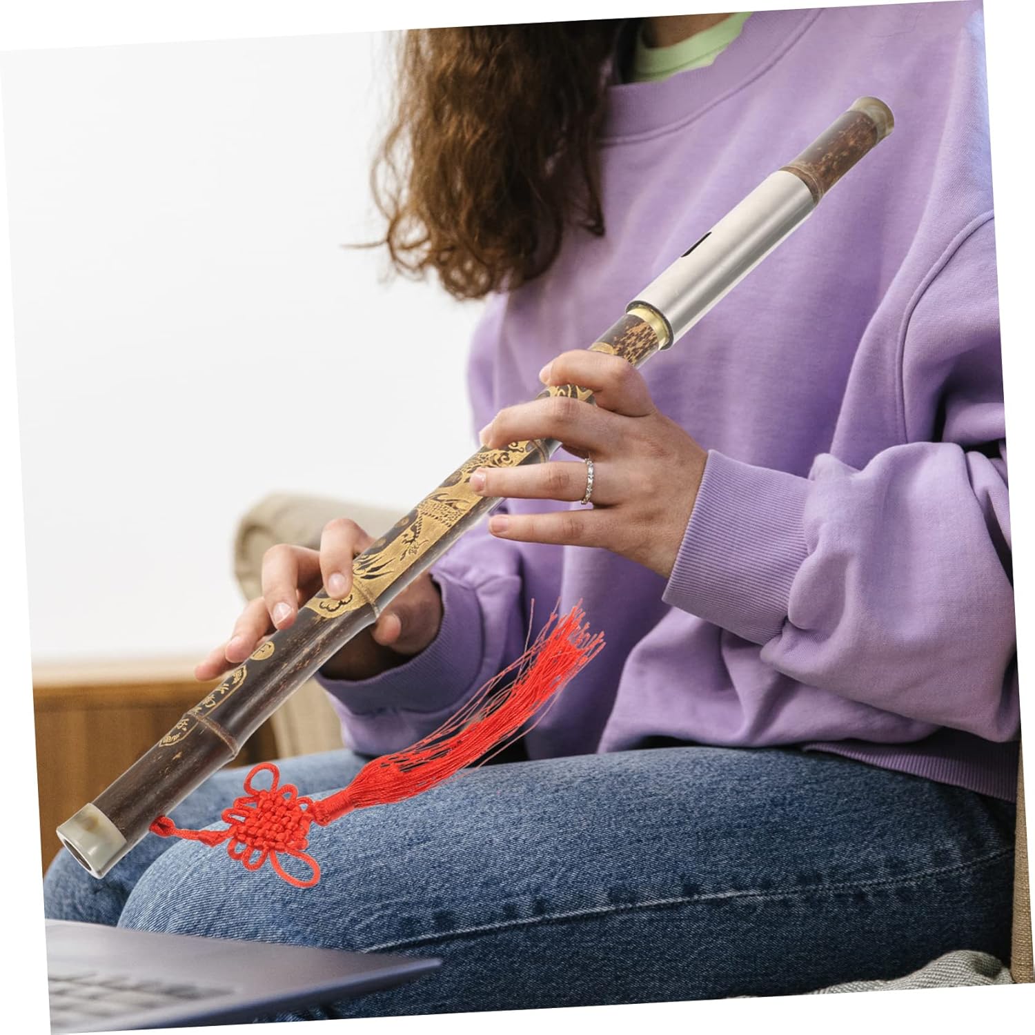 Person playing the Mikinona Bawu Flute