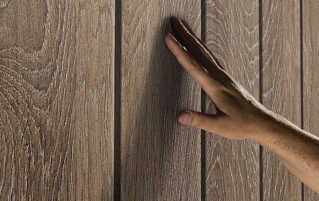 Close-up of the shed's wood-look wall panel texture